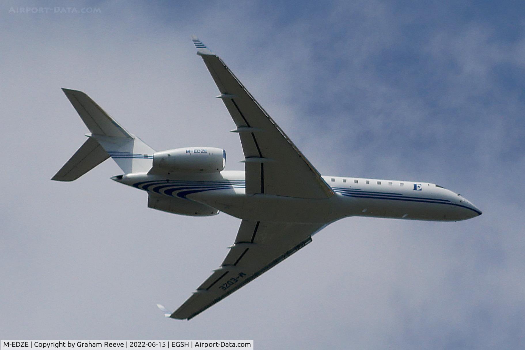M-EDZE, 2001 Bombardier BD-700-1A10 Global Express C/N 9097, Over head at Norwich.