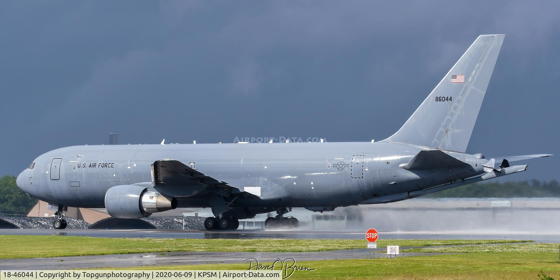 18-46044, 2019 Boeing KC-46A Pegasus C/N 34086/1170, REACH31 blasts all the rain off the runway on takeoff