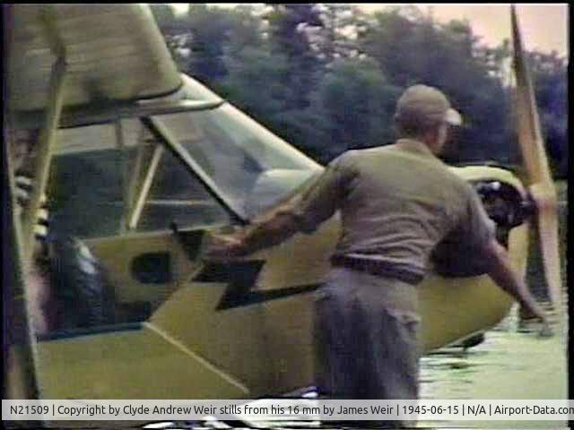 N21509, 1938 Piper J3C-65 Cub C/N 2384, NC21509 flown by Stan Hurst giving rides at Enterprise Lake Wisconsin 1945.