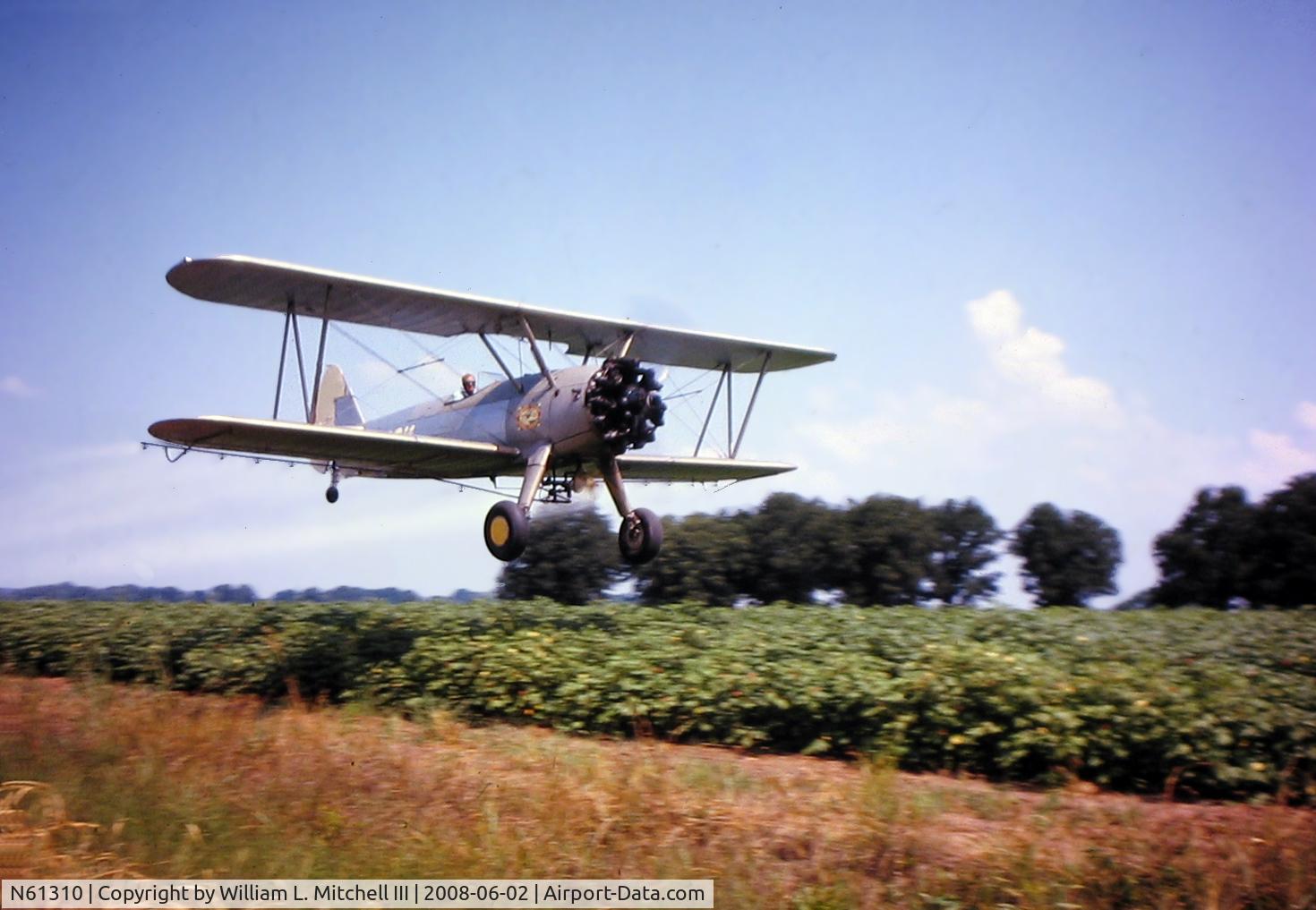 N61310, 1941 Boeing A75N1(PT17) Kaydet C/N 75-1963, Boeing Stearman N61310 shown spraying pesticide on cotton on Ralph R. McKinney's farm in Hosston, Louisiana during the 1960's. The pilot of the plane is Sherman Wynn.