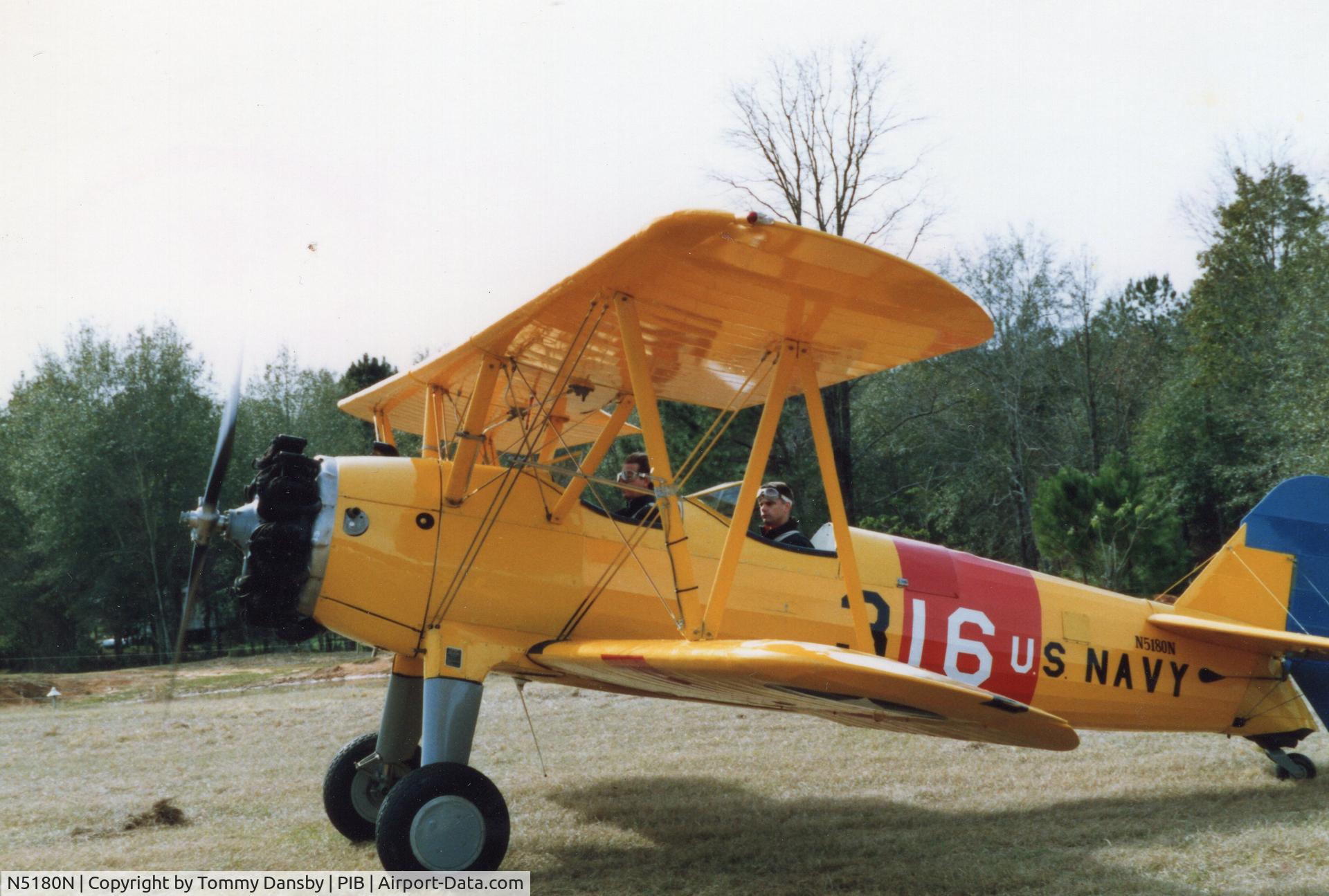 N5180N, 1943 Boeing E75 C/N 75-5439, This photo was taken at Charles Morgan Airfield (Grass Strip) in Sanford, Mississippi sometime around 1990. There was a small fly-in gathering with several unique aircraft  on-site. These gentlemen were offering rides to the crowd.