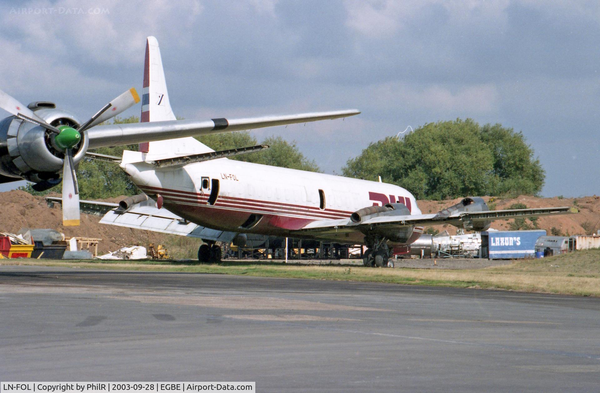LN-FOL, 1960 Lockheed L-188A(F) Electra C/N 1116, Looking derelict on the ramp at Baginton. Registered as G-LOFG in 2000, registration cancelled in 2004 and used as fire trainer until broken up in 2011.