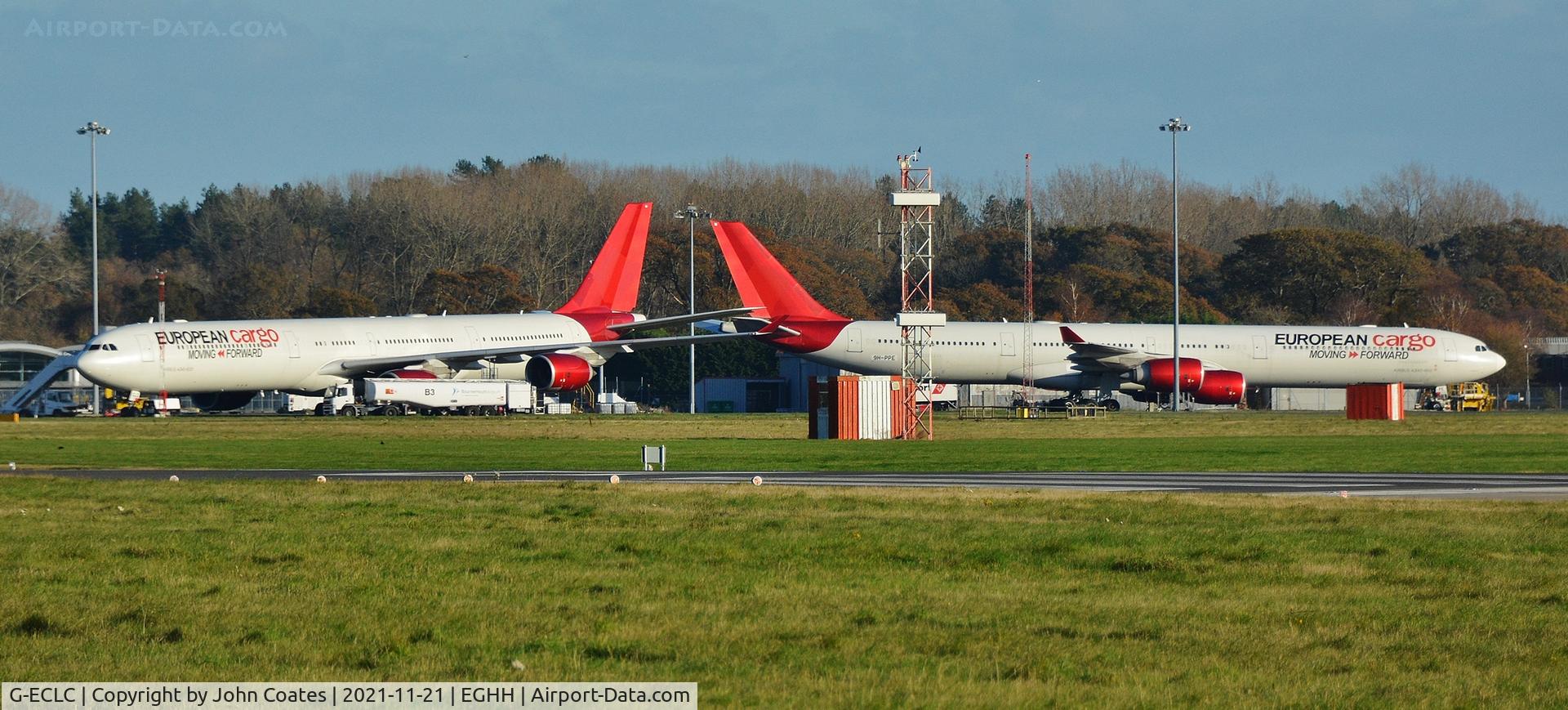 G-ECLC, 2006 Airbus A340-642 C/N 768, With 9H-PPE on the cargo apron