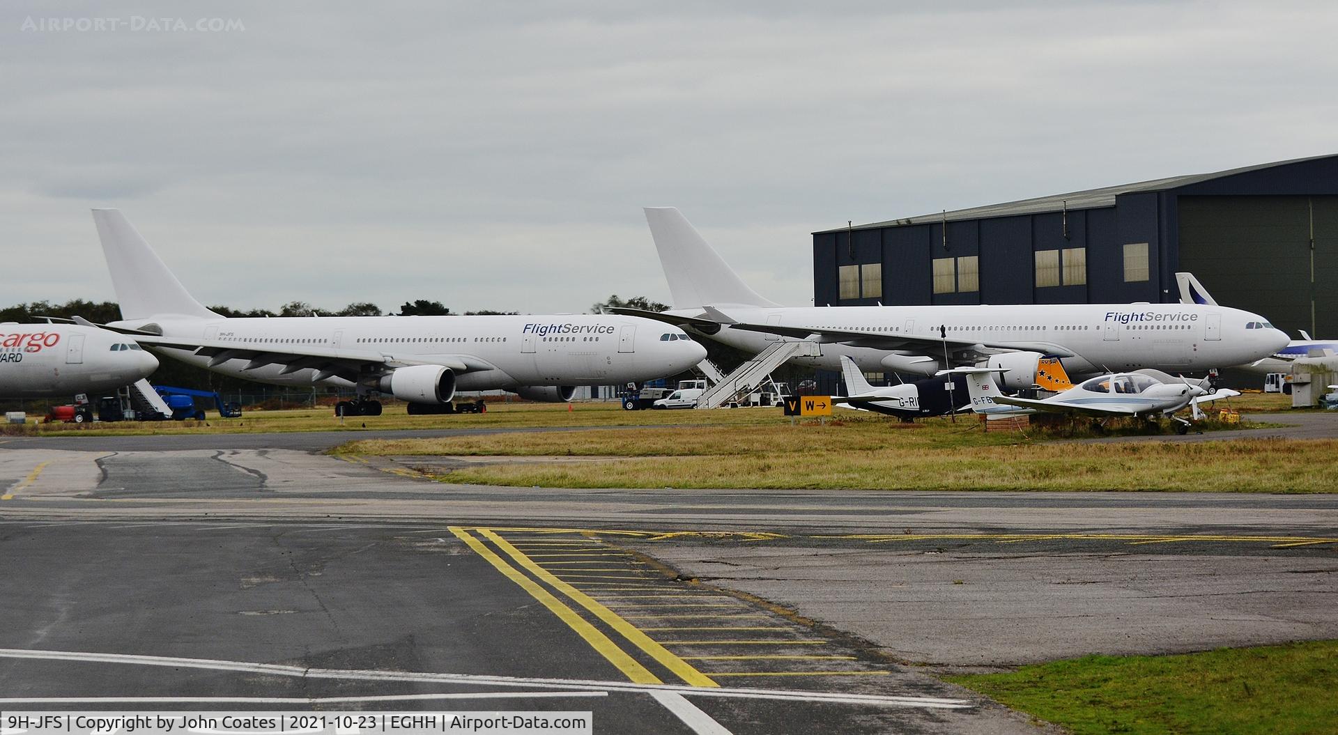 9H-JFS, 2002 Airbus A330-203 C/N 466, With 9H-LFS at cargo parking