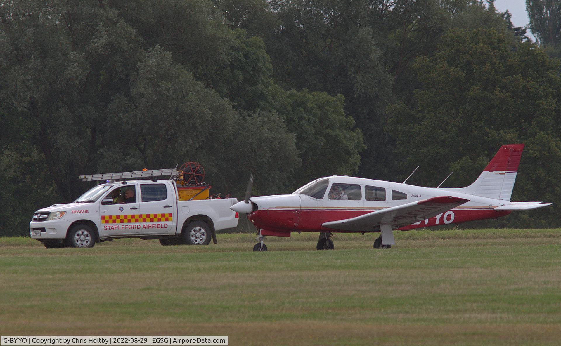 G-BYYO, 1994 Piper PA-28R-201 Cherokee Arrow III C/N 28R-2837061, Pilot alerted EGSG control tower to a possible landing gear problem but landed safely escorted by the airfield rescue service vehicle.