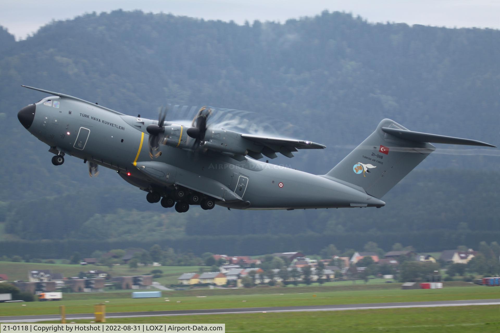21-0118, 2022 Airbus A400M Atlas C/N 118, Due to high moisture in the air showing prop and wingtip vortices besides a flashing anti-collision beacon
