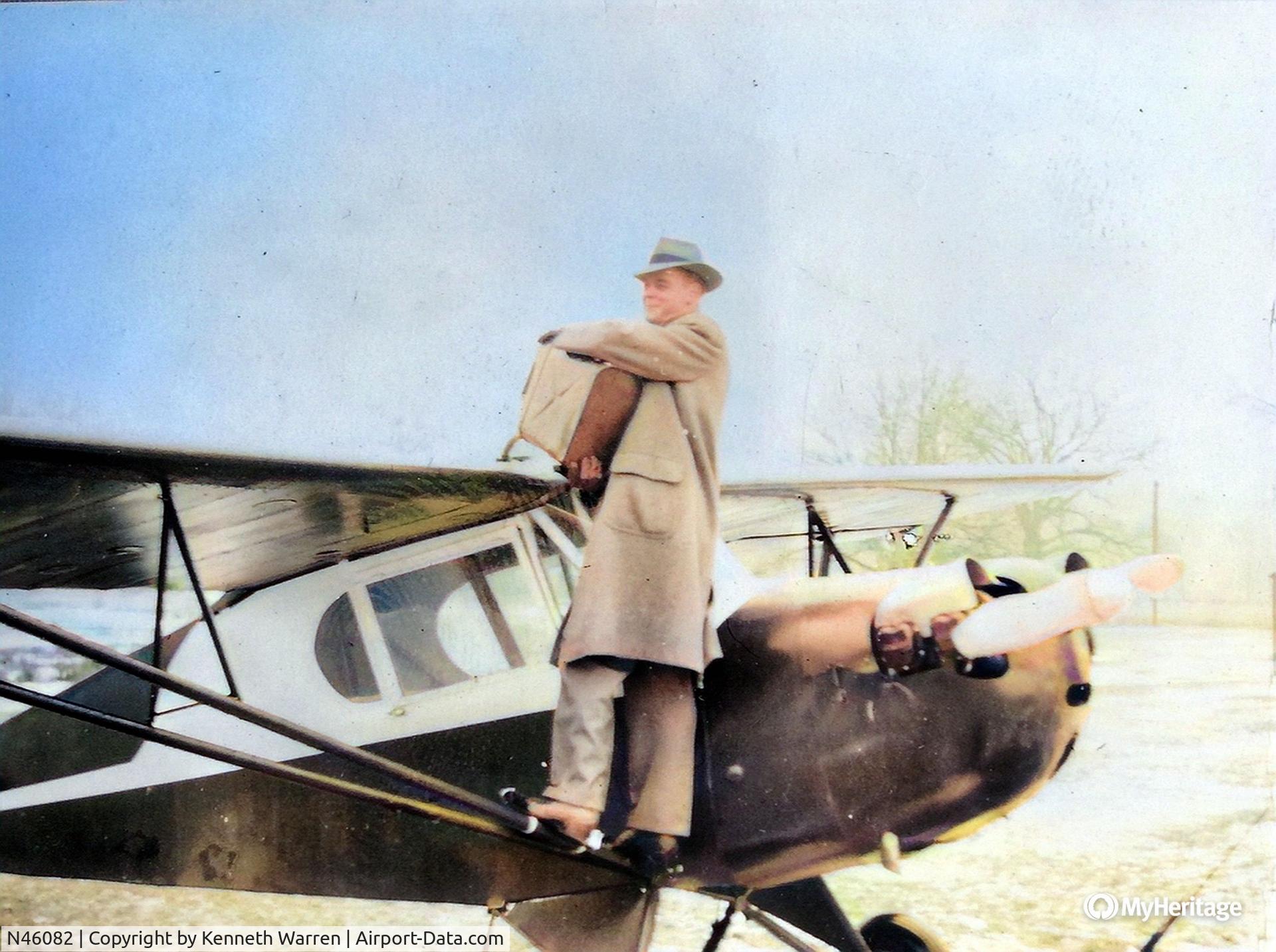 N46082, 1942 Aeronca 0-58B Grasshopper C/N 058B6212, Fuel stop in Connecticut sometime around 1949 on a trip to NY...
The new paint scheme was a dark red with white trim (the colorization process wasn't able to capture this).