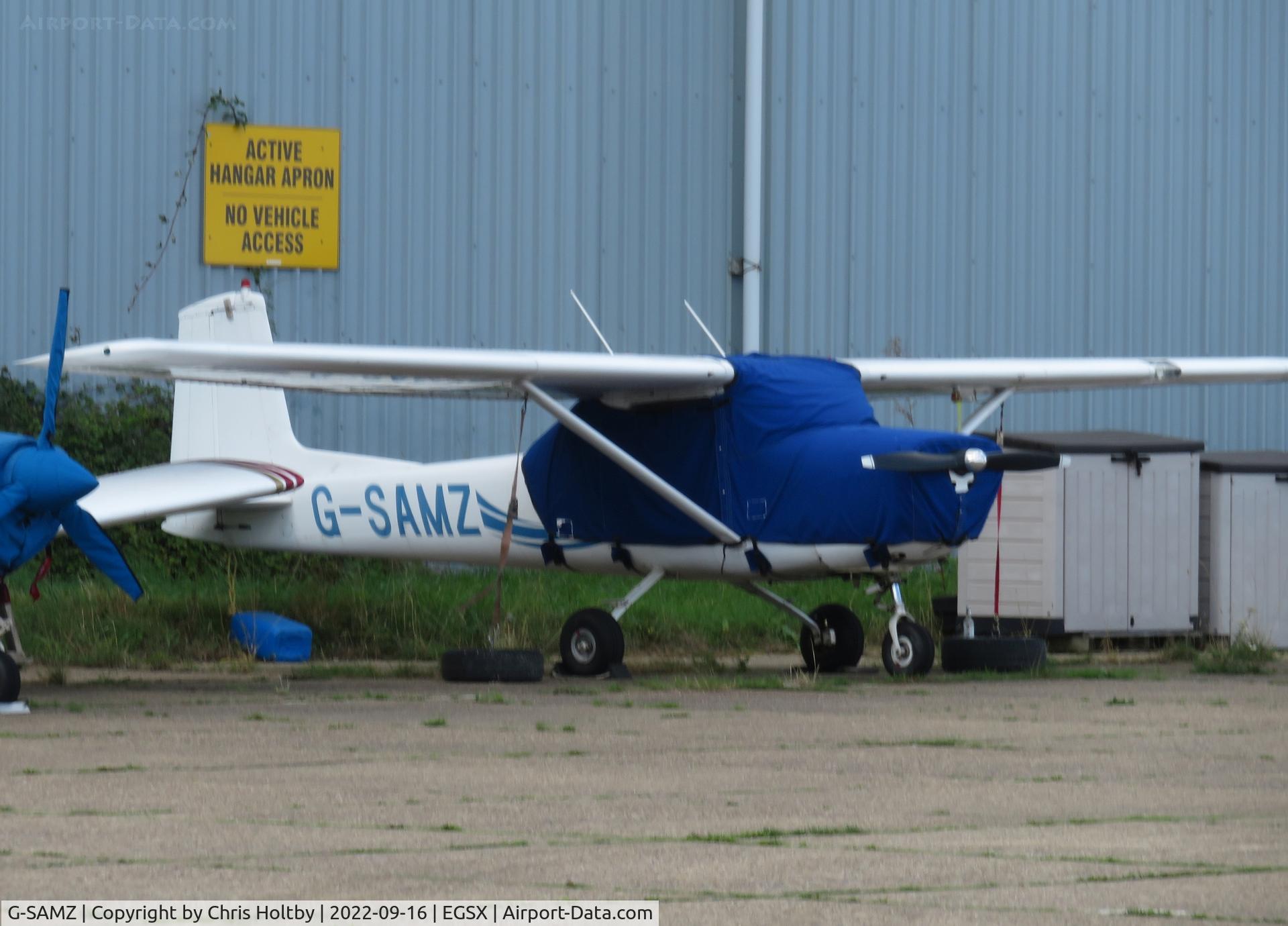G-SAMZ, 1964 Cessna 150D C/N 150-60536, Parked and covered at North Weald, Essex