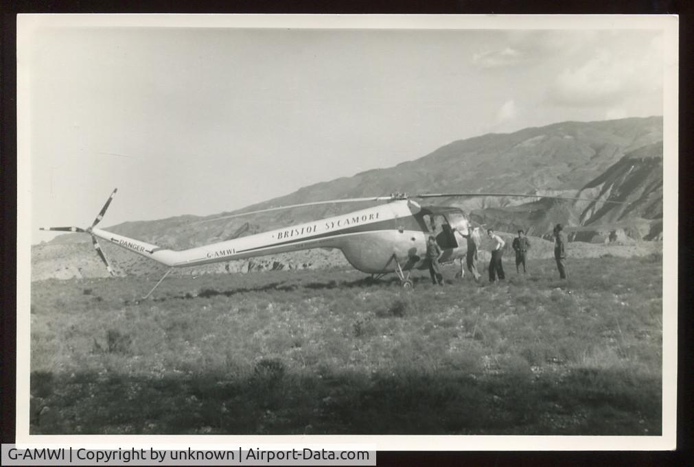 G-AMWI, 1952 Bristol 171 Sycamore HR.51 C/N 13070, Shown landed on grassy upland. Location unknown

Copyright unknown but no annotation to verso