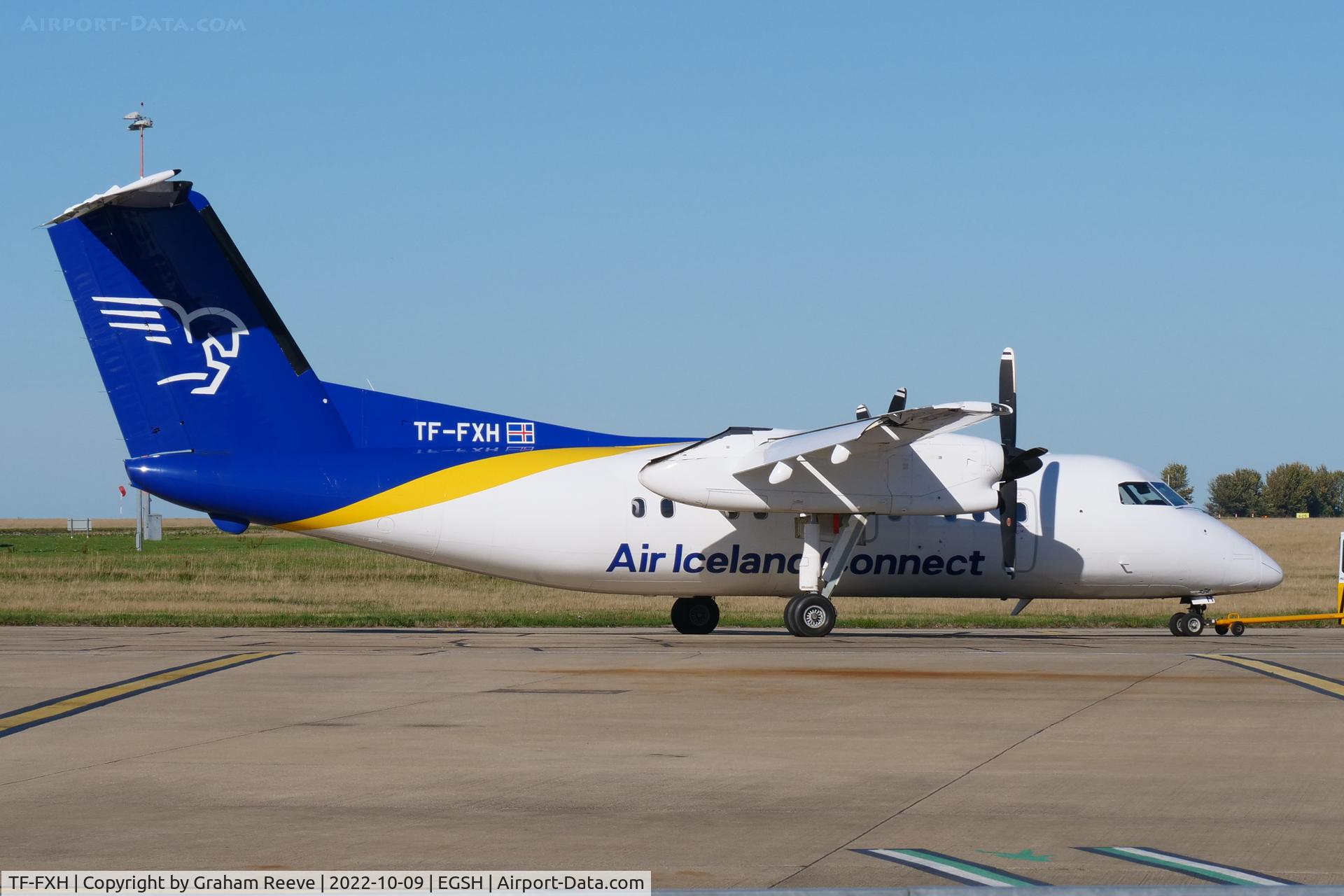 TF-FXH, 1997 De Havilland Canada DHC-8-202 Dash 8 C/N 450, Under tow at Norwich.
