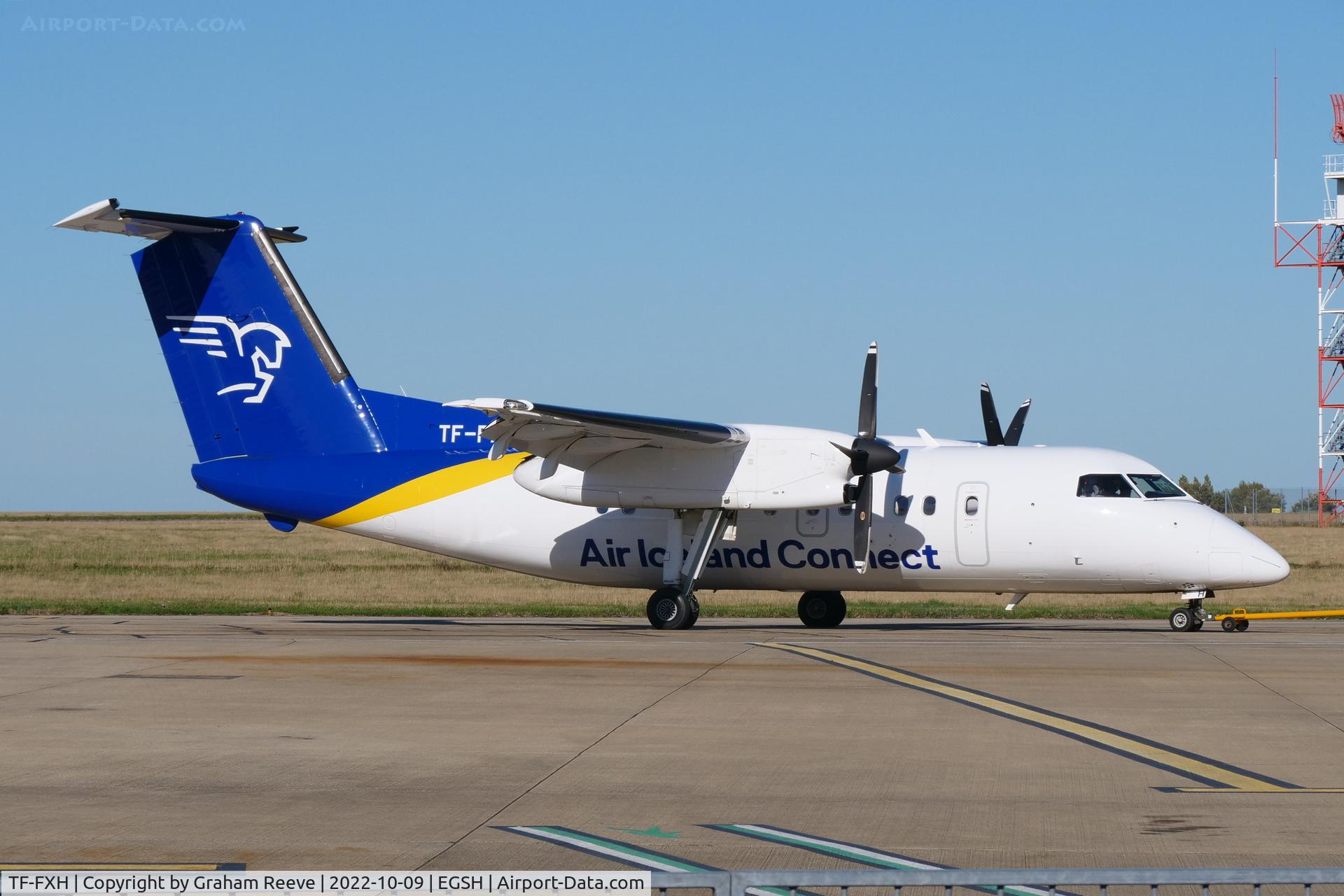 TF-FXH, 1997 De Havilland Canada DHC-8-202 Dash 8 C/N 450, Under tow at Norwich.