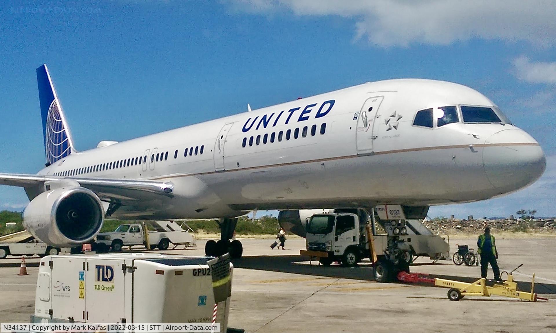 N34137, 1999 Boeing 757-224 C/N 30229, United 752 at the gate in STT preparing for departure to EWR