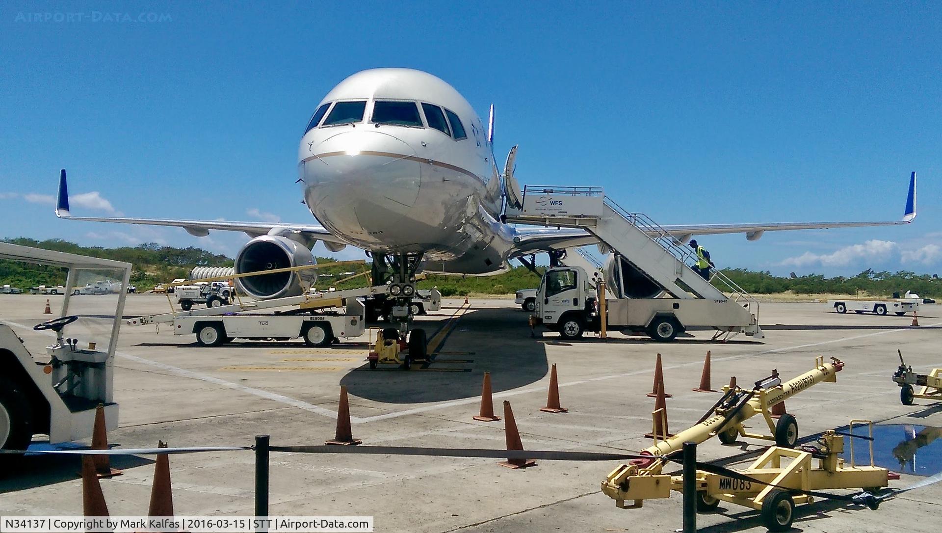 N34137, 1999 Boeing 757-224 C/N 30229, United 752 at the gate in STT preparing for departure to EWR