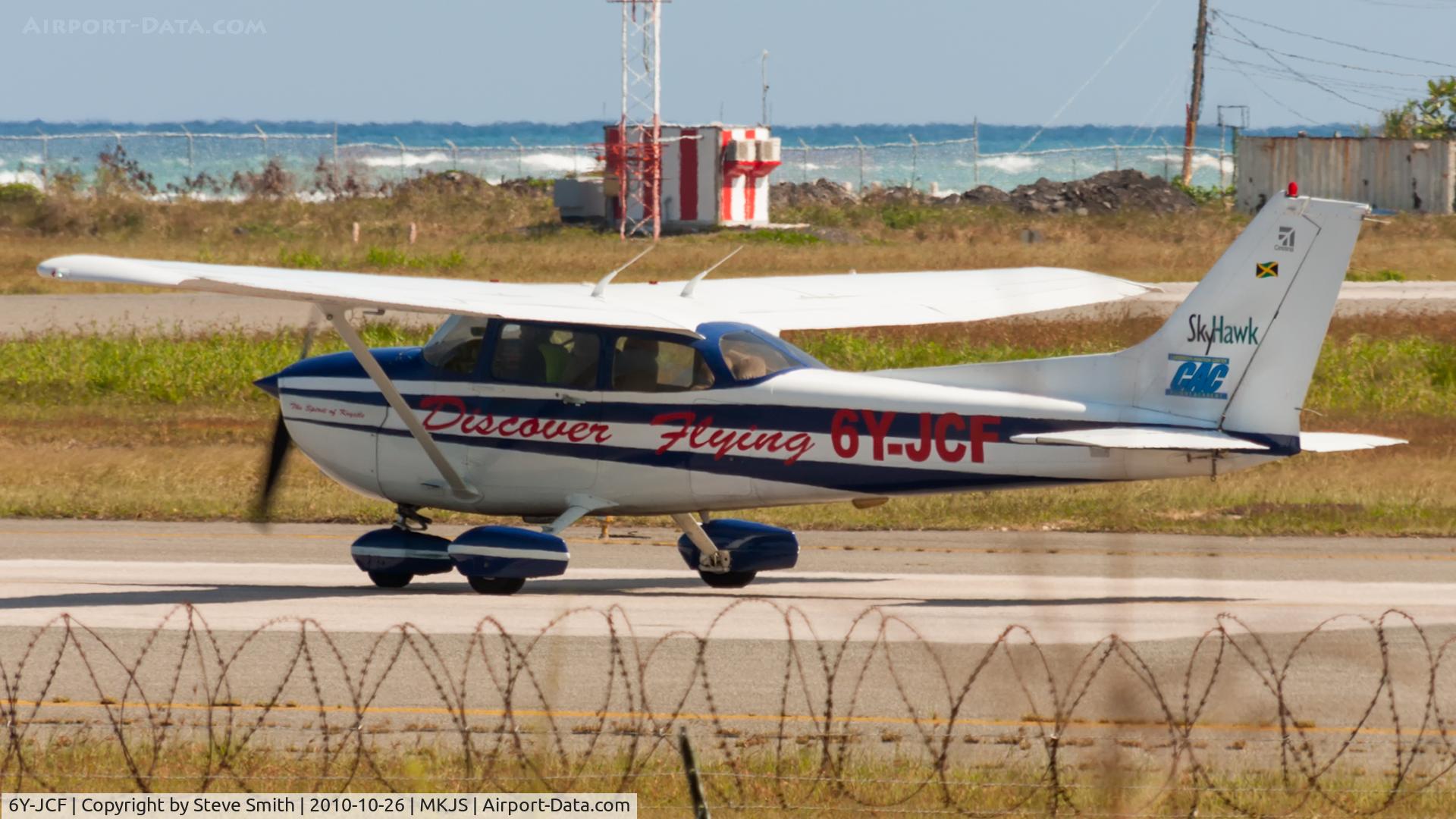 6Y-JCF, 2002 Cessna 172R C/N 17281110, Waiting for clearance to enter Runway 07 for Local flight.