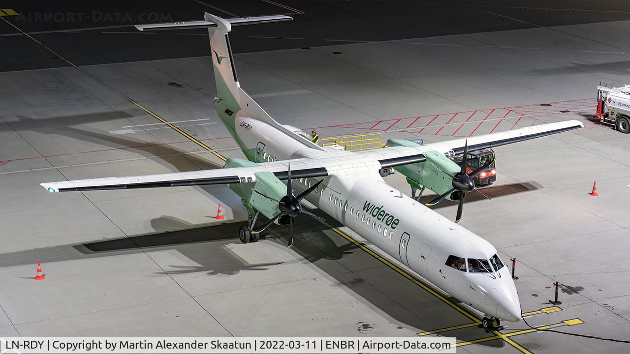 LN-RDY, 2002 De Havilland Canada DHC-8-402Q Dash 8 C/N 4062, Parked to the terminal in the evening.