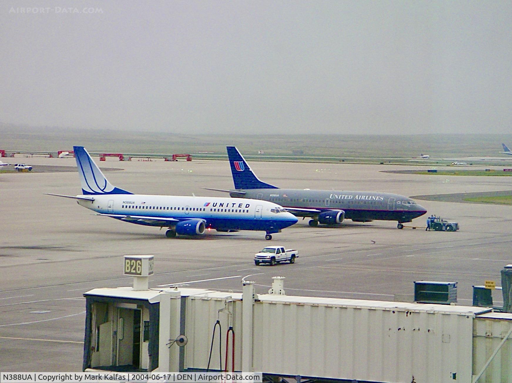 N388UA, 1990 Boeing 737-322 C/N 24663, N388UA on the ramp next to N310UA at Denver