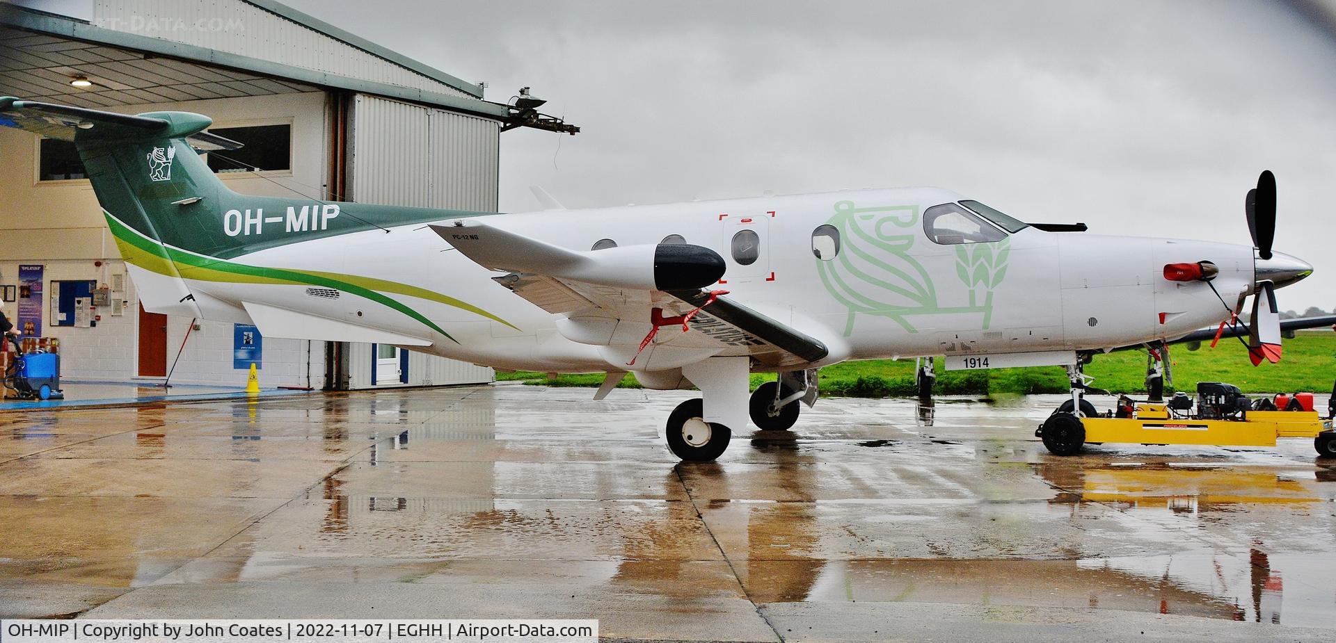 OH-MIP, 2019 Pilatus PC-12/47E C/N 1914, Being pushed inside out of the pouring rain