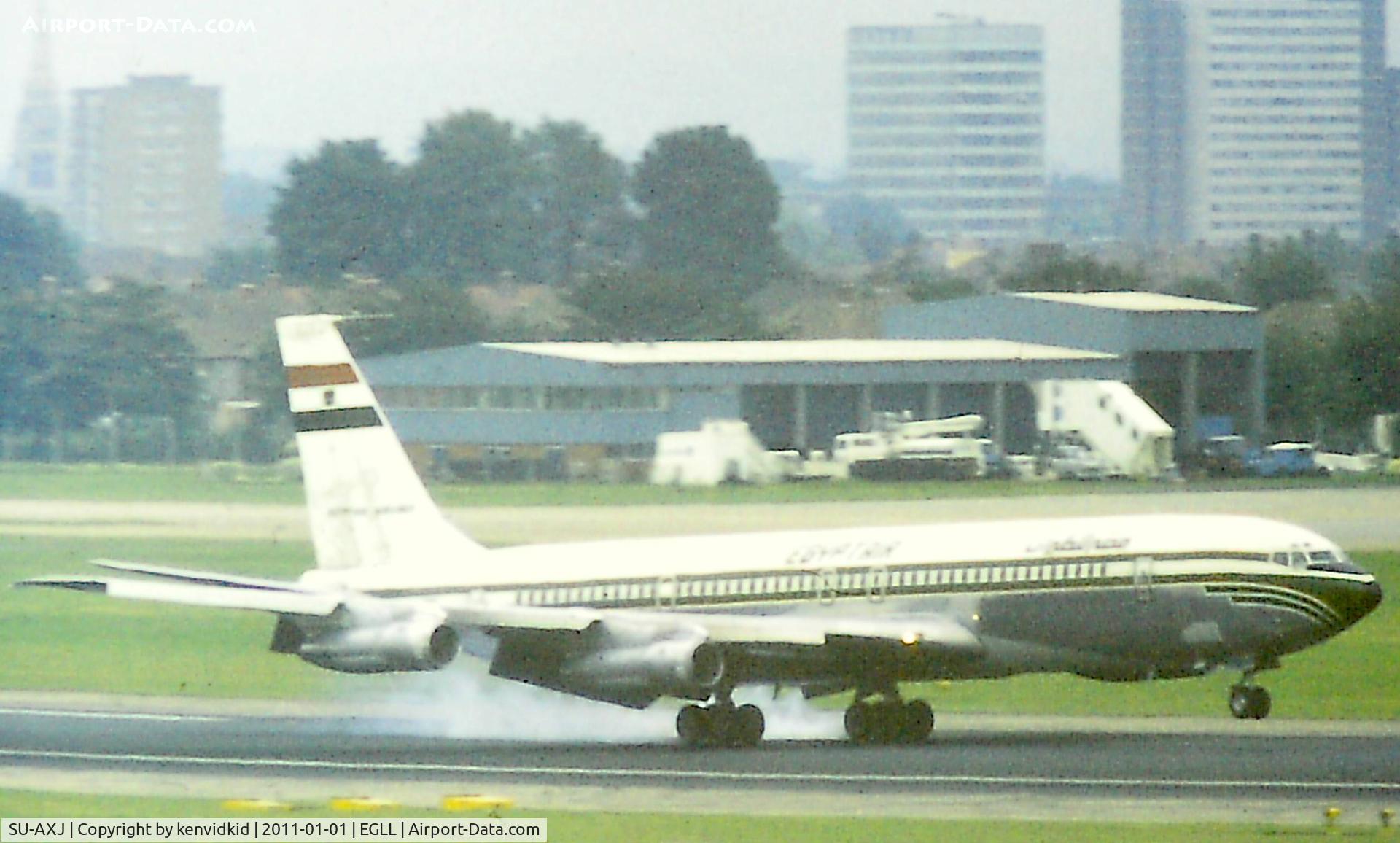 SU-AXJ, 1974 Boeing 707-366C C/N 20919, At Heathrow. Copied from slide.