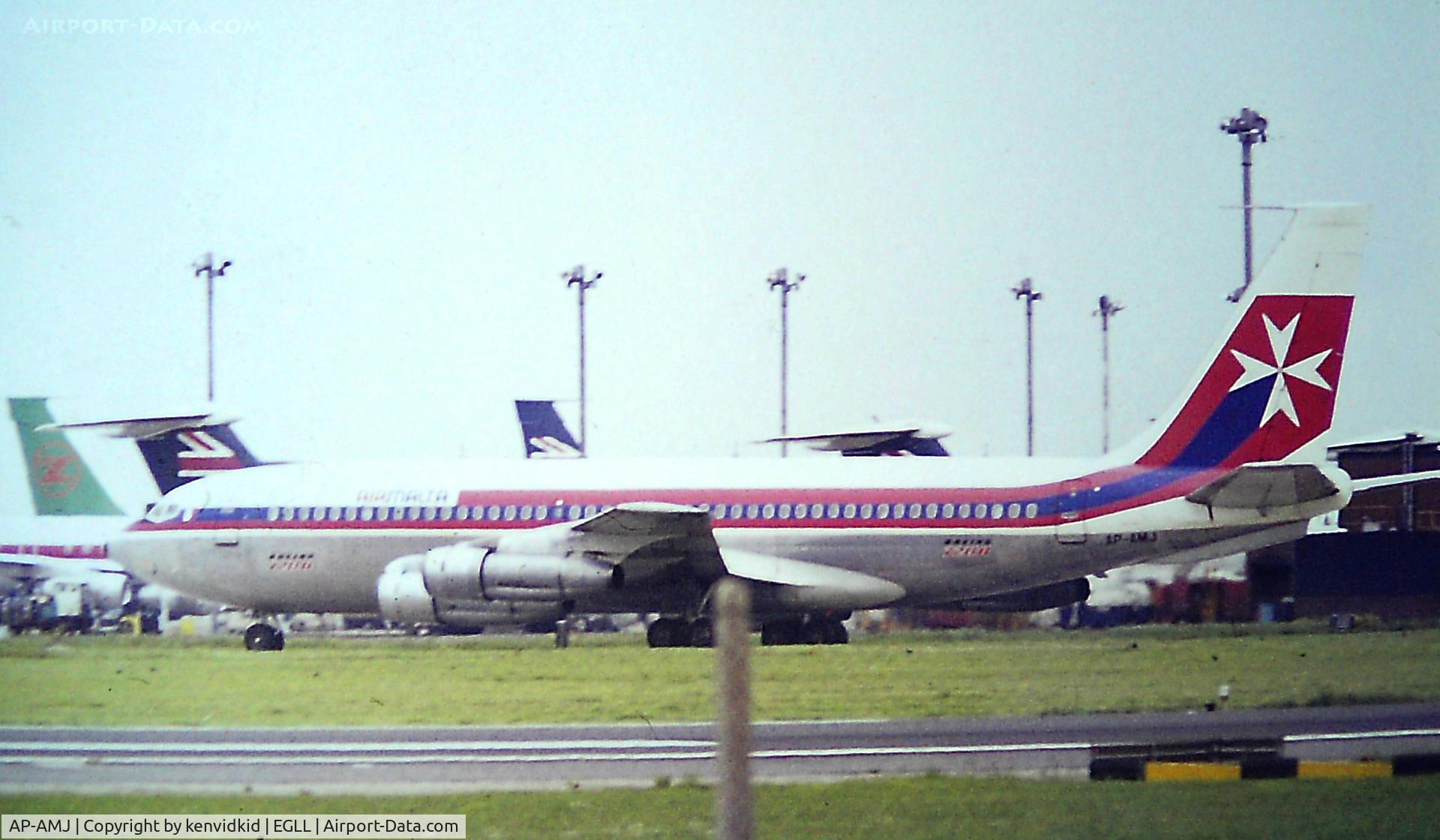AP-AMJ, 1962 Boeing 720-040B C/N 18380, At Heathrow. Copied from slide.