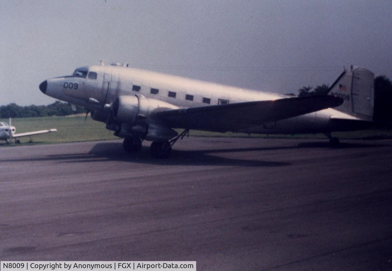 N8009, 1949 Douglas DC-3C C/N 4193, This picture was taken around 1984-85 at Fleming-Mason Airport. It would come in a few times that year and refuel.
Picture was probably taken by my mom.