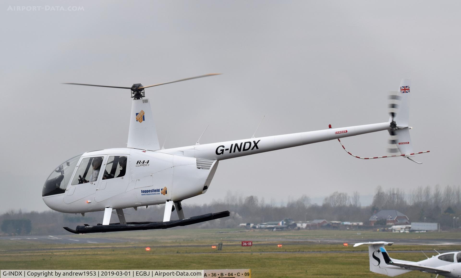 G-INDX, 2004 Robinson R44 Clipper II C/N 10491, G-INDX landing at Gloucestershire Airport.