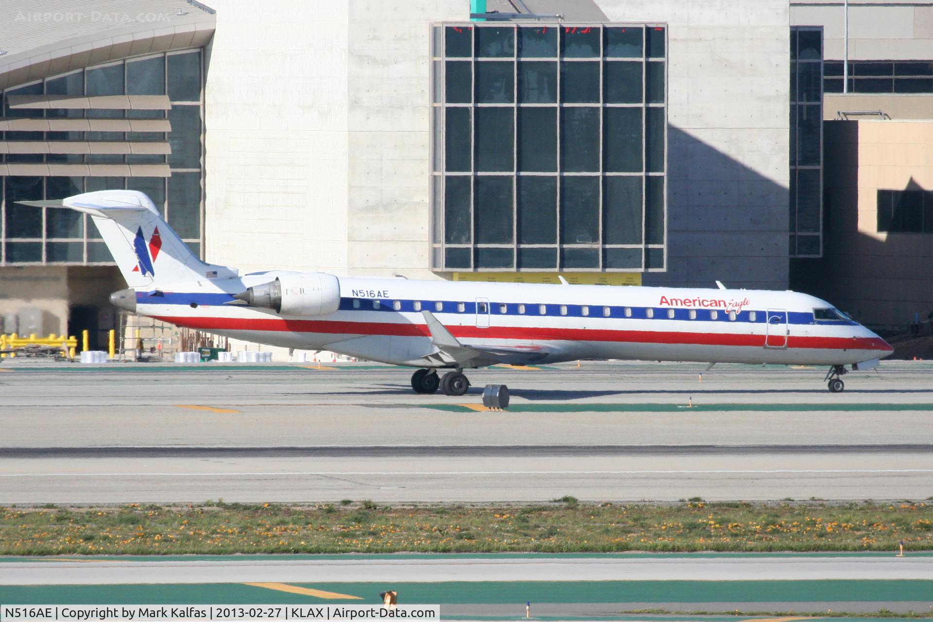 N516AE, 2003 Bombardier CRJ-701ER (CL-600-2C10) Regional Jet C/N 10123, American Eagle CRJ7, N516AE at LAX