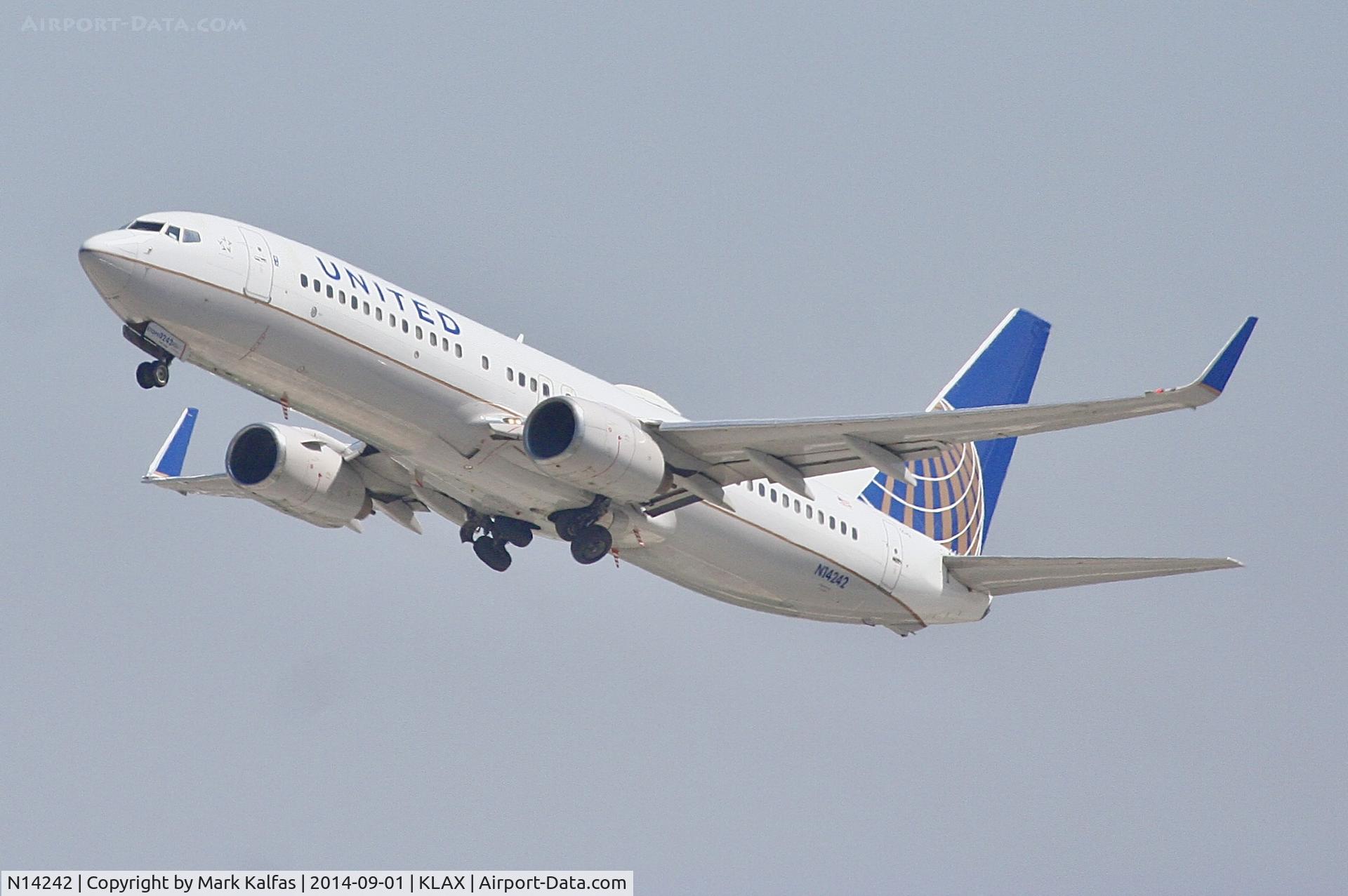 N14242, 1999 Boeing 737-824 C/N 28805, United Boeing 737-824, N14242 departing 25R LAX