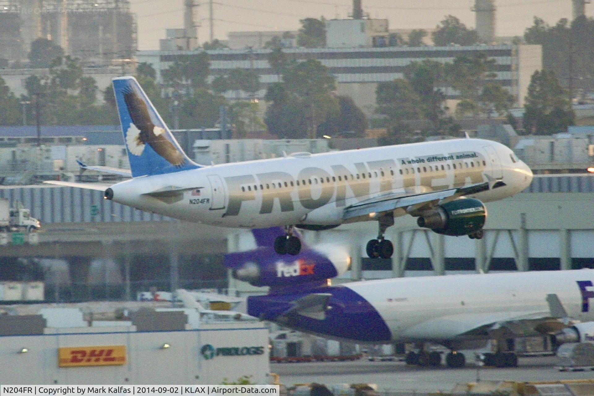 N204FR, 2004 Airbus A320-214 C/N 2325, Frontier Airbus A320-214, on 25L approach LAX