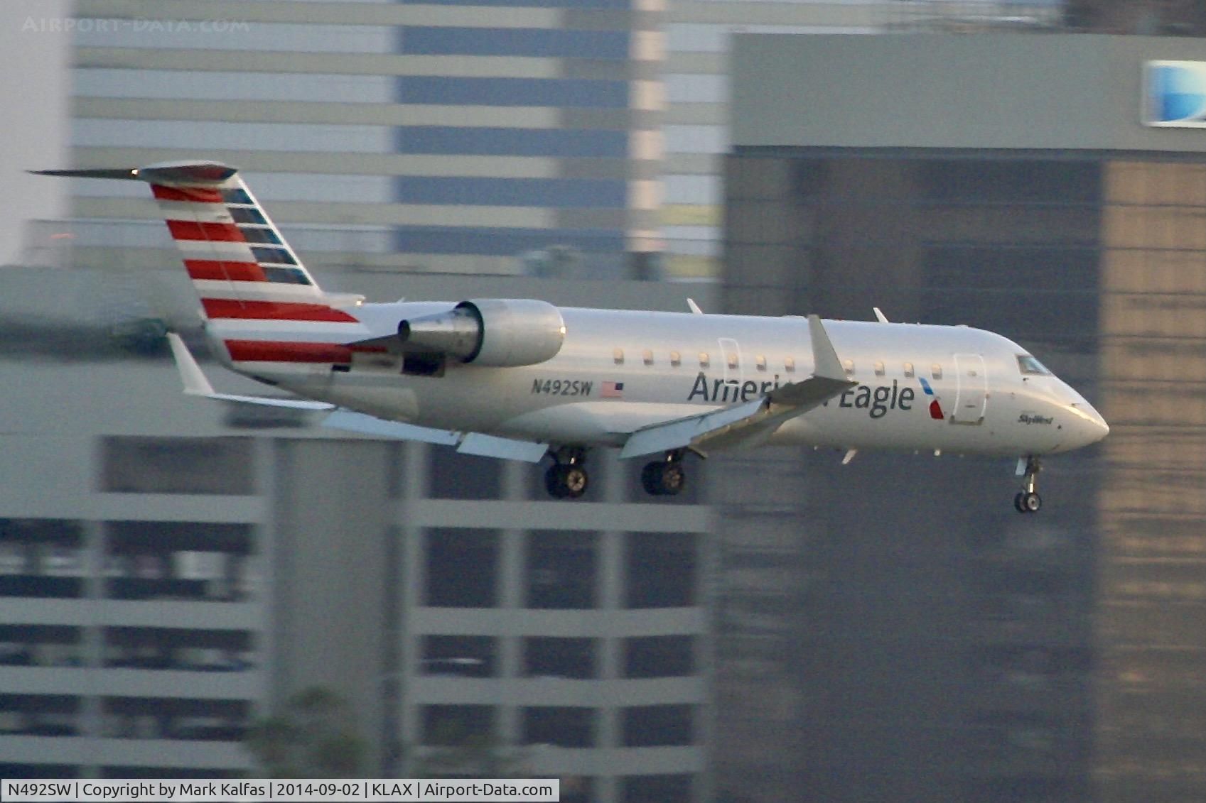N492SW, 1997 Canadair CRJ-100ER (CL-600-2B19) C/N 7168, SkyWest/American Eagle Canadair CRJ-100ER, N492SW 25L approach KLAX