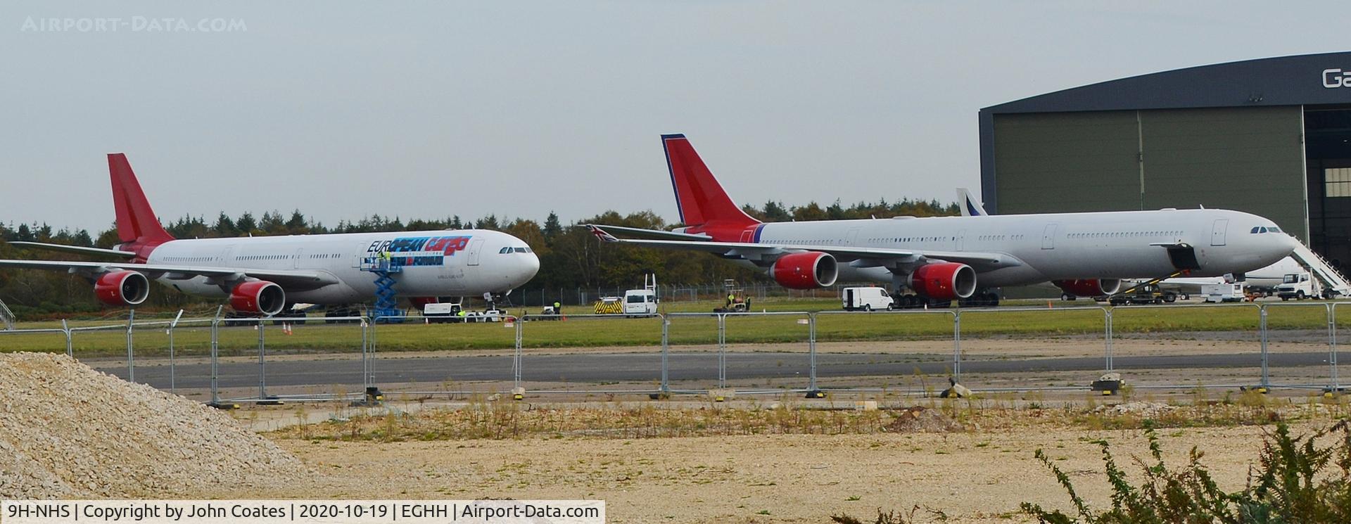 9H-NHS, 2006 Airbus A340-642 C/N 736, Waiting with 9H-EAL for new European Cargo titles to be applied