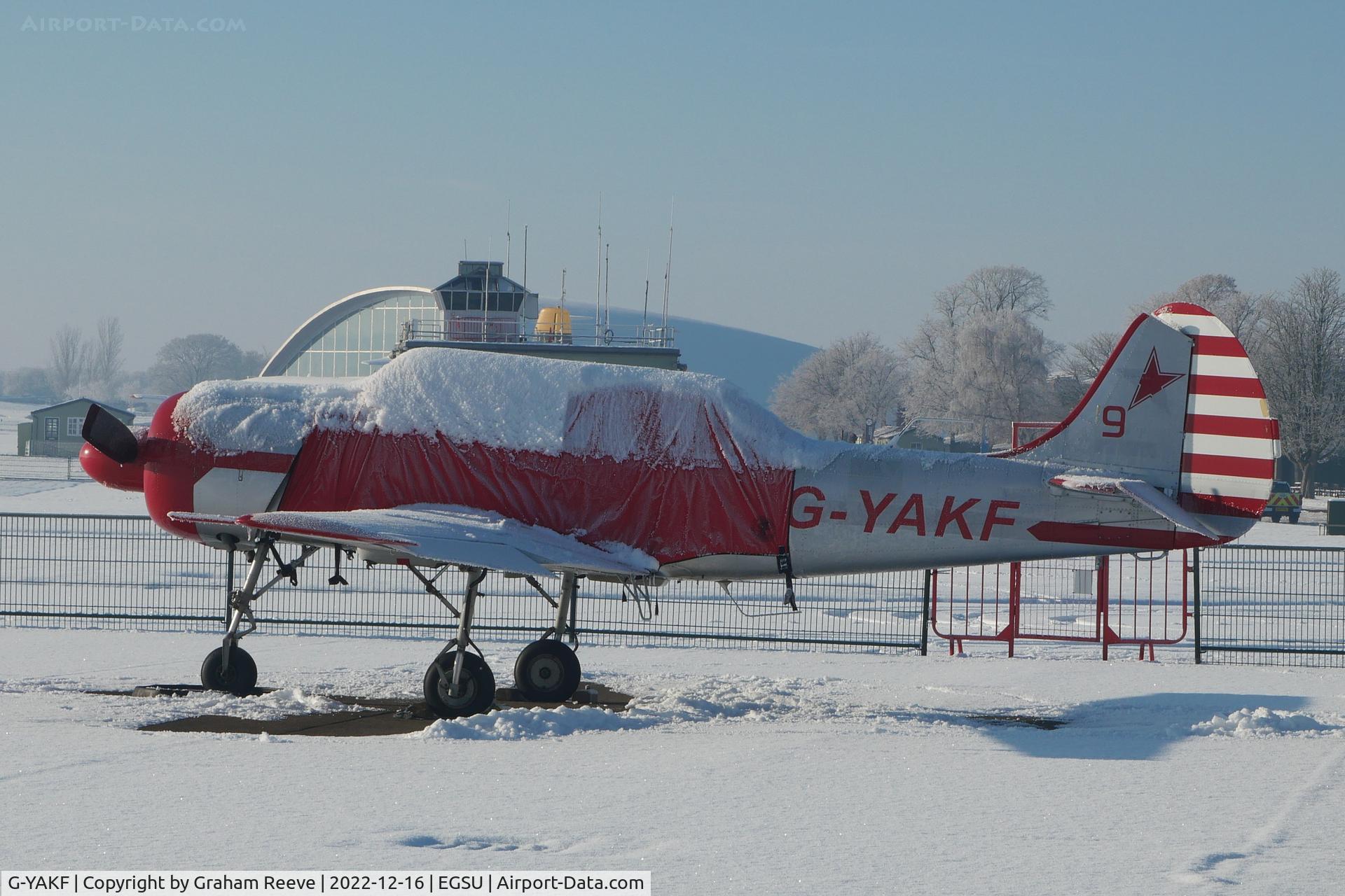 G-YAKF, 1991 Yakovlev (Aerostar) Yak-52 C/N 9111205, Parked at Duxford in the snow.