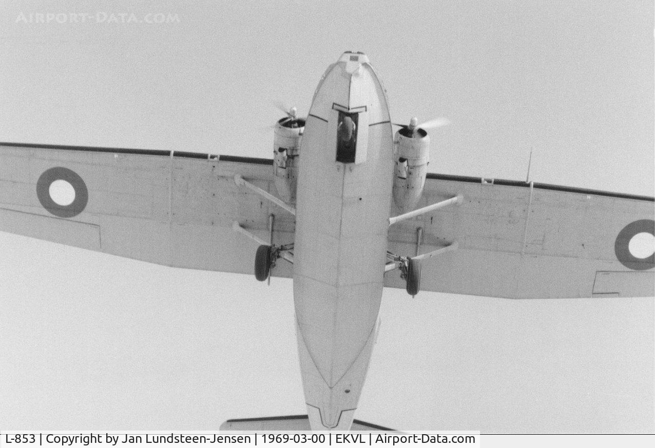 L-853, 1944 Consolidated (Canadian Vickers Canso) PBY-5A Catalina C/N CV316, PBY-5A L-853 seen from below while on final approach 
to runway 28 at Vaerloese Air Base in Denmark. Snow 
on ground lights up underside of plane. This Royal Danish Air Force Catalina crashed December 11, 1969.