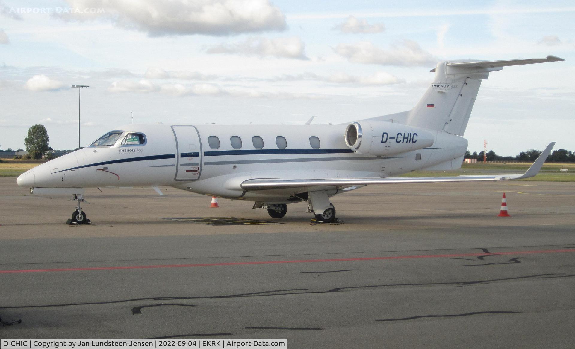 D-CHIC, 2012 Embraer EMB-505 Phenom 300 C/N 50500096, Embraer 505 Phenom 300 D-CHIC seen parked on the apron at Roskilde Airport with a 'Brakes Off' sign in the cockpit side window.