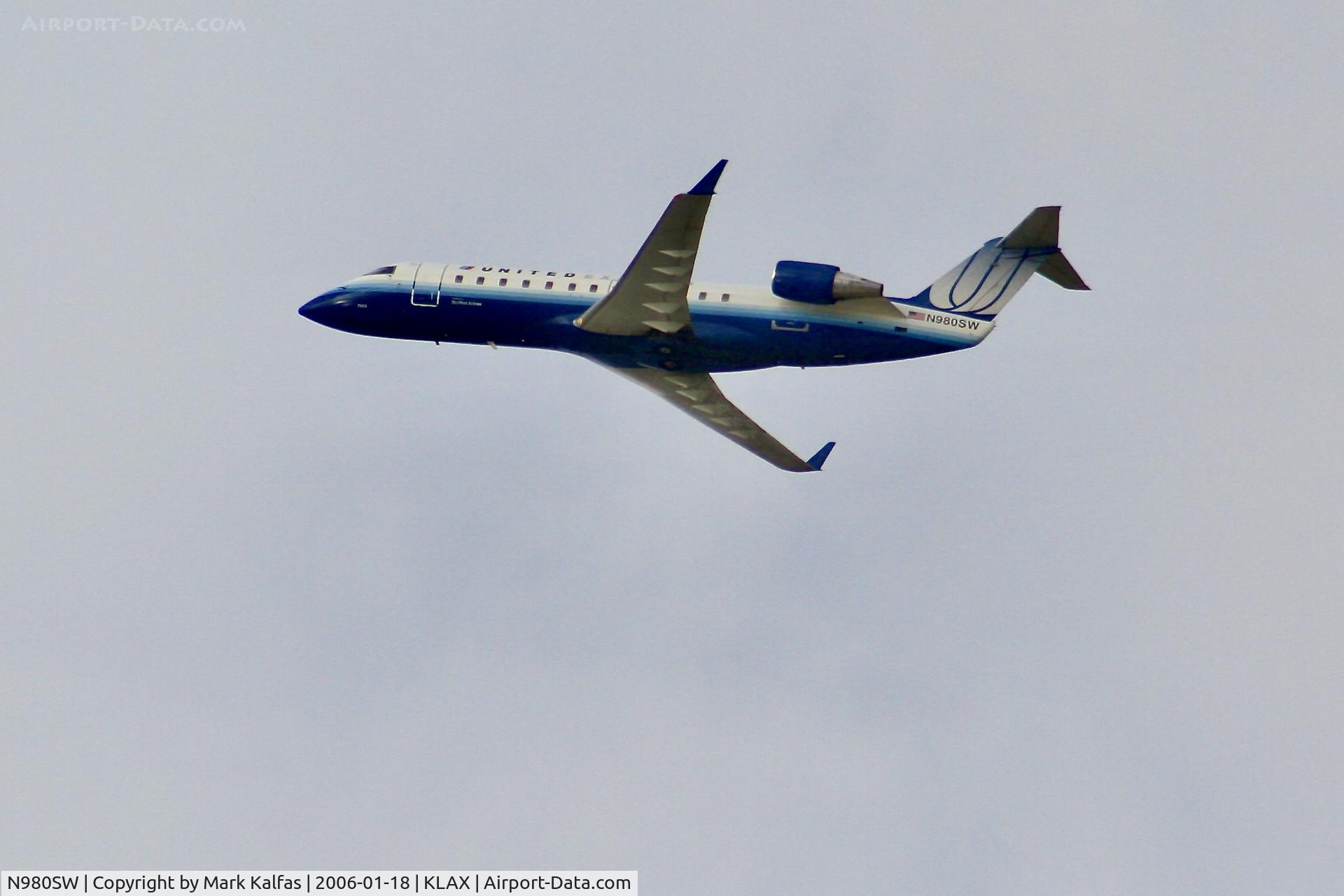 N980SW, 2004 Bombardier CRJ-200ER (CL-600-2B19) C/N 7955, SkyWest/United Express Bombardier CRJ-200ER, N980SW departing 25R LAX.
