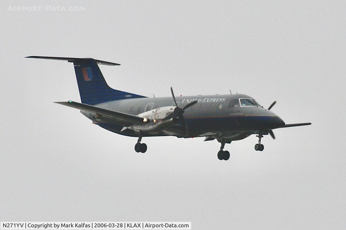 N271YV, 1993 Embraer EMB-120ER Brasilia C/N 120271, SkyWest/United Express Embraer EMB-120ER, N271YV on a stormy approach to runway 7R LAX