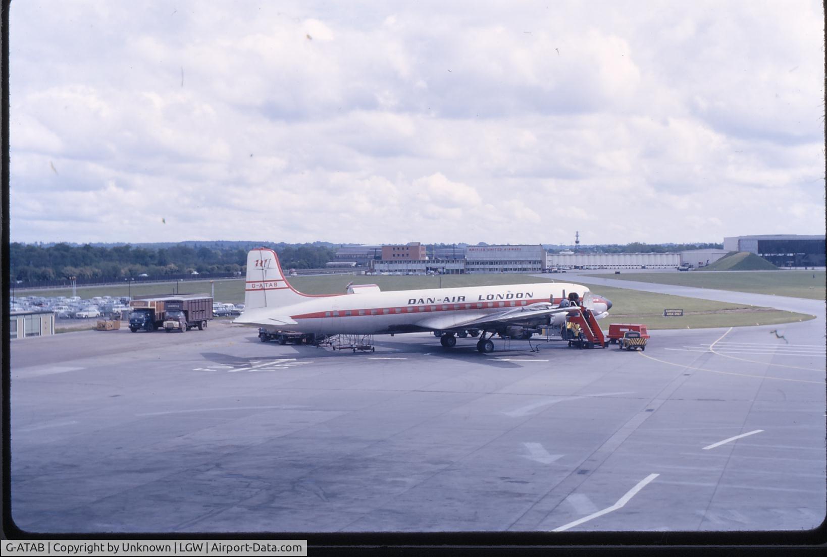 G-ATAB, 1957 Douglas DC-7BF C/N 45361, Dan Air DC7B loading racehorses at Gatwick  COPYRIGHT