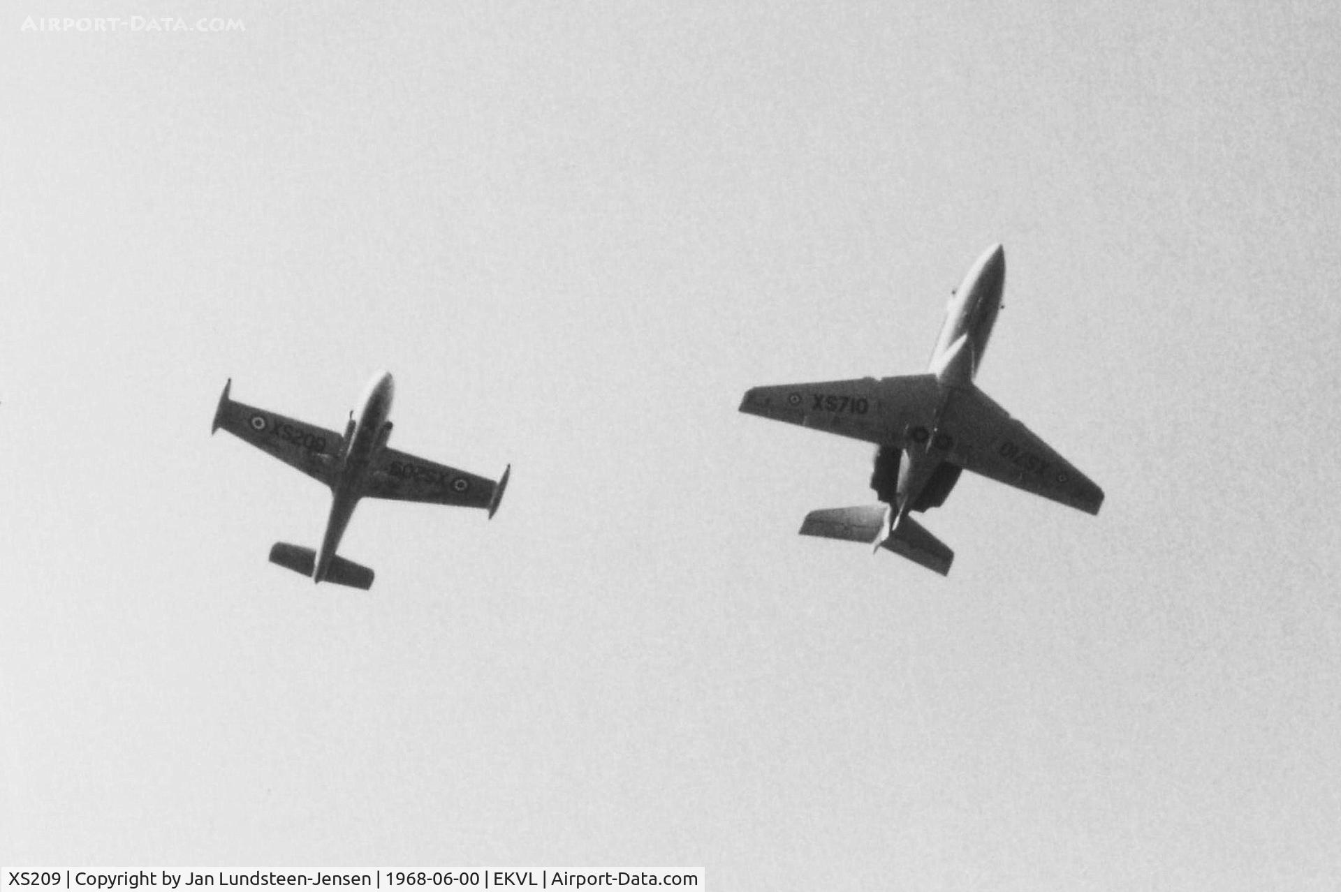 XS209, 1964 BAC 84 Jet Provost T.4 C/N PAC/W/22177, RAF Jet Provost XS209 (Left in photo) seen in formation with RAF Dominie XS710 shortly after overflying Runway 10 at Vaerloese Air Base in Denmark in June 1968.