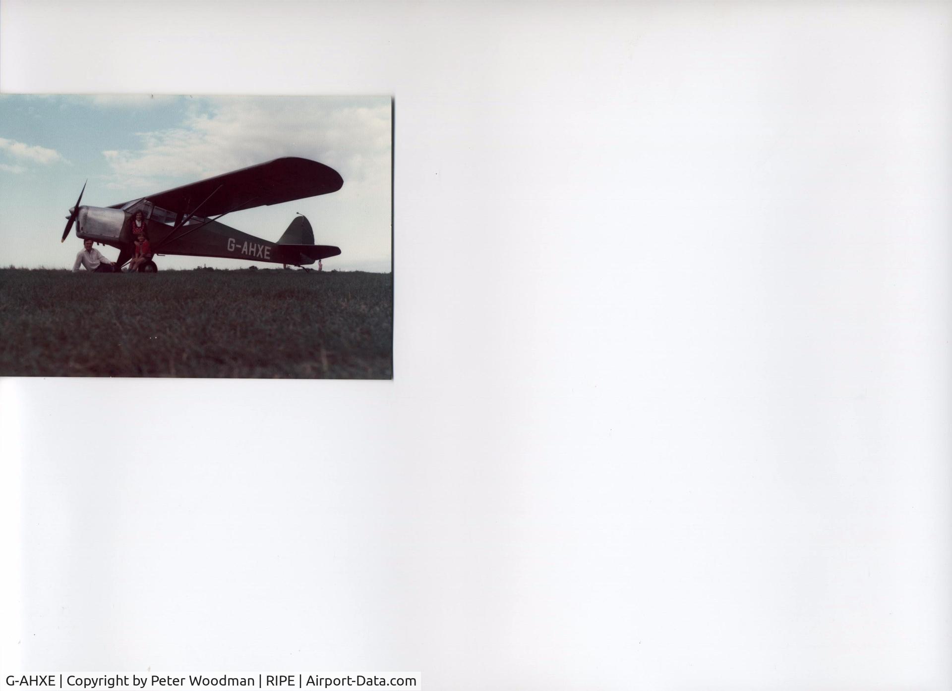 G-AHXE, 1942 Taylorcraft Auster Plus D C/N 171, I was a part owner of this aircraft, having collected it from Horsea Island, Essex. This picture is at Ripe airstrip on August 24th 1974. Although it is a 2-seater, I flew my 6-year-old son and 10-year-old daughter in the little plane from Shoreham.