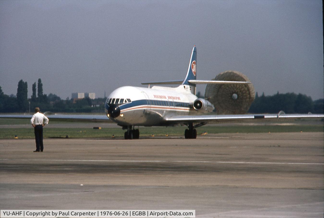 YU-AHF, 1967 Sud Aviation SE-210 Caravelle VI-N C/N 218, My photo of YU-AHF, Saturday 26th June 1976 at BHX, EGBB, Birmingham Airport, taxiing to stand at the Old Elmdon Terminal with the braking arrester chute deployed. Is the fella looking on thinking How am I going to fold that thing up and re pack it. LOL.