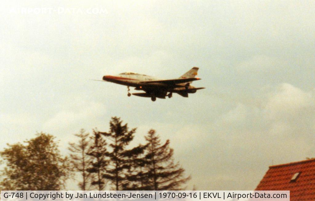 G-748, 1955 North American F-100D Super Sabre C/N 224-15, F-100D G-748 from Royal Danish Air Force seen on final 
approach to runway 28 at Vaerloese Air Base in 
Denmark in 1970. Photo taken from the home garden, 
when I was a boy.