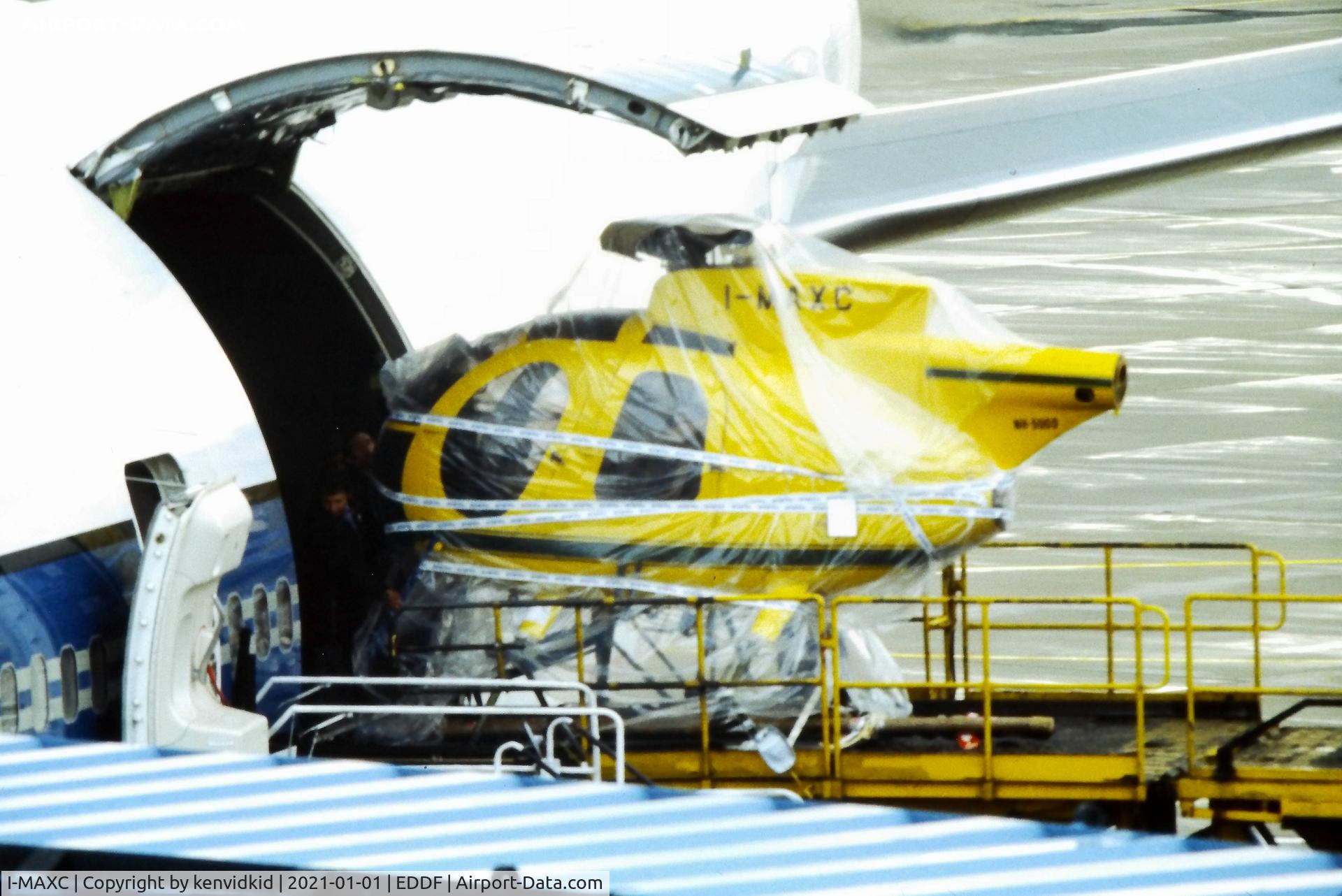 I-MAXC, Hughes 369D C/N 400688D, Being loaded into a Varig Boeing 747 at Frankfurt, early 1980's.