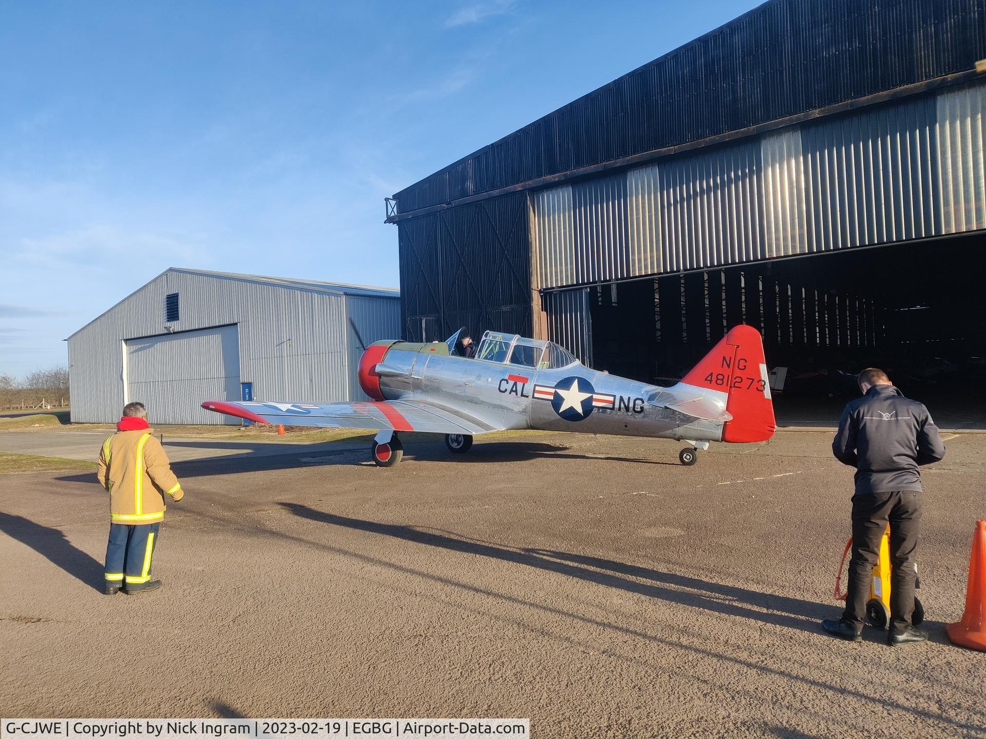G-CJWE, 1952 Canadian Car & Foundry T-6 Harvard Mk.4 C/N CCF4-97, Aircraft taxied away from hangar by the go-kart track under fire crew escort.  Returned 20-30 minuets later.