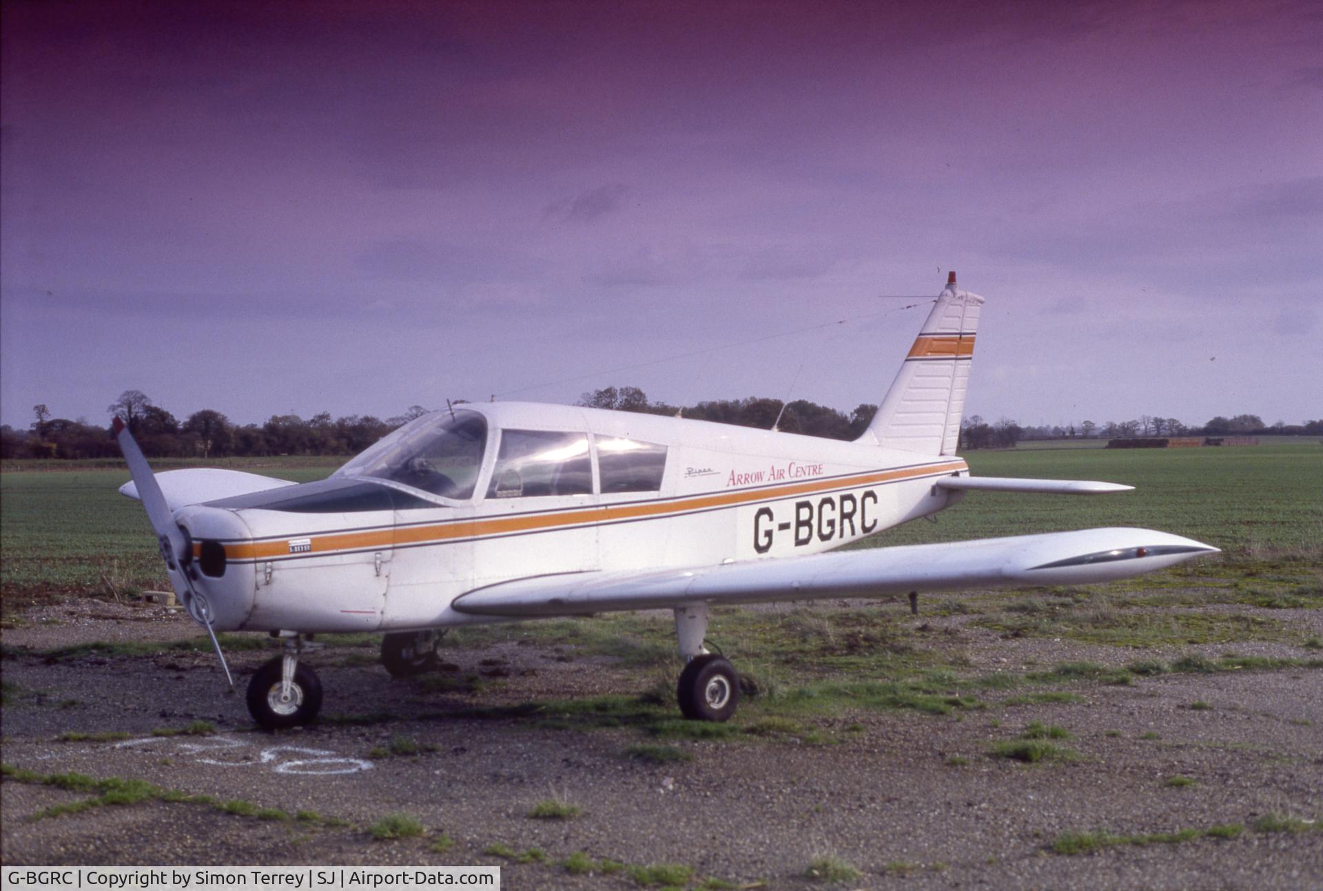 G-BGRC, 1969 Piper PA-28-140 Cherokee C/N 28-26208, We had just hard-nose landed and the nose wheel had gone into the engine (I was told by the pilot). It felt like it was rumbling down a cobbled road taxiing after we landed. The fire truck was called out but we were OK. Shot taken at Shipdham Aerodrome.