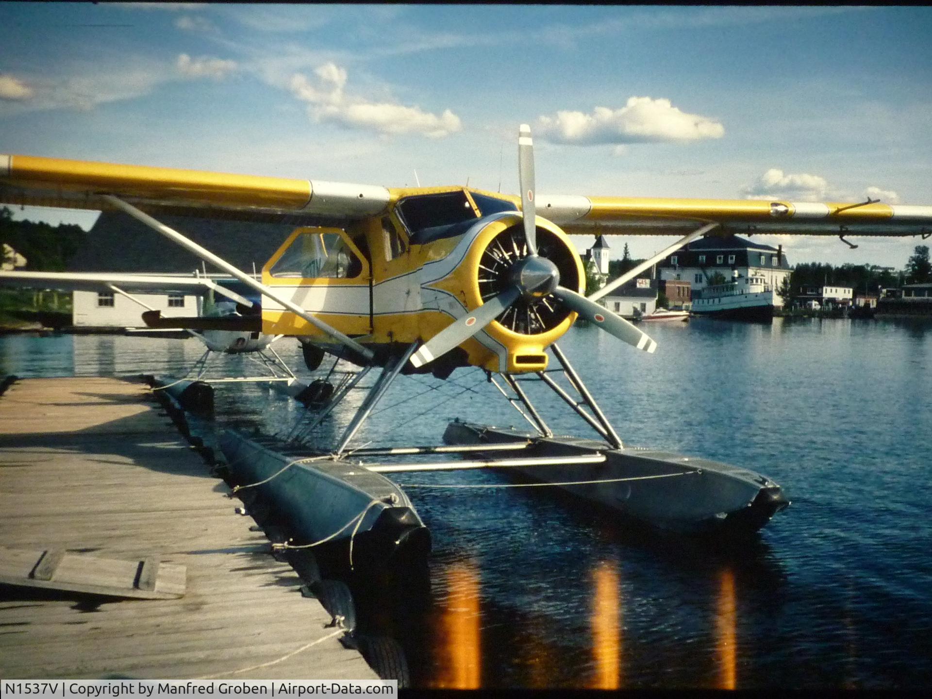 N1537V, 1953 De Havilland Canada DHC-2 Beaver Mk.1 C/N 494, we booked a short round flight with it in 1993 somewhere in Maine.
we were told it was the airplane used for Camel advertisments in the 70s, produced in south america and imported from there to USA.
Picture taken with Minox 35 GT and digitalized later