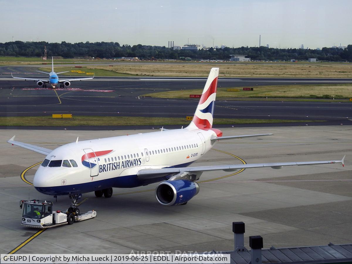 G-EUPD, 1999 Airbus A319-131 C/N 1142, PH-EZW in the background