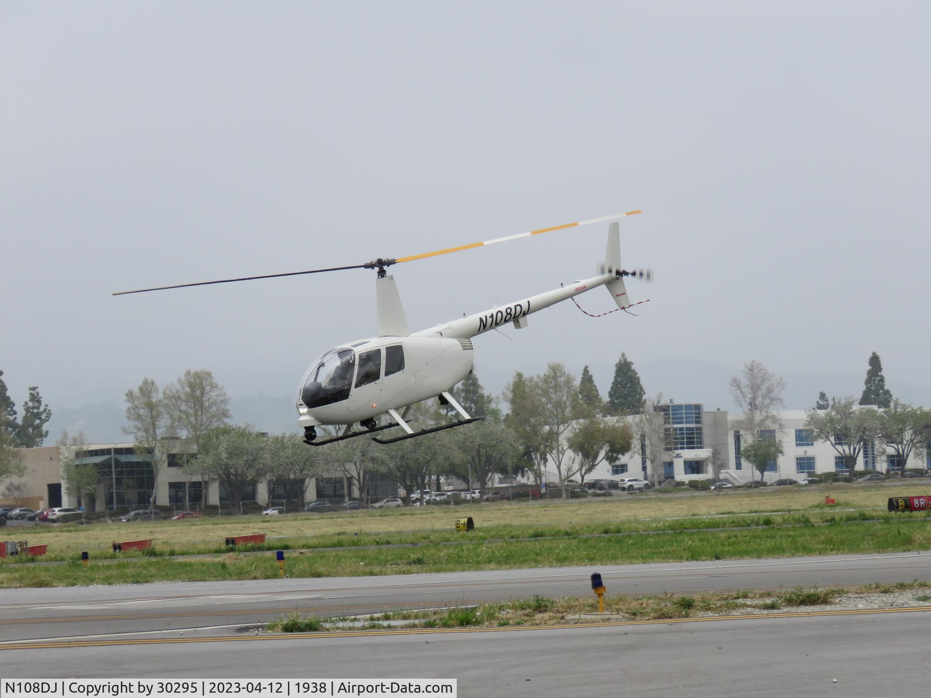 N108DJ, 2001 Robinson R44 C/N 1060, Taking off in a westerly direction