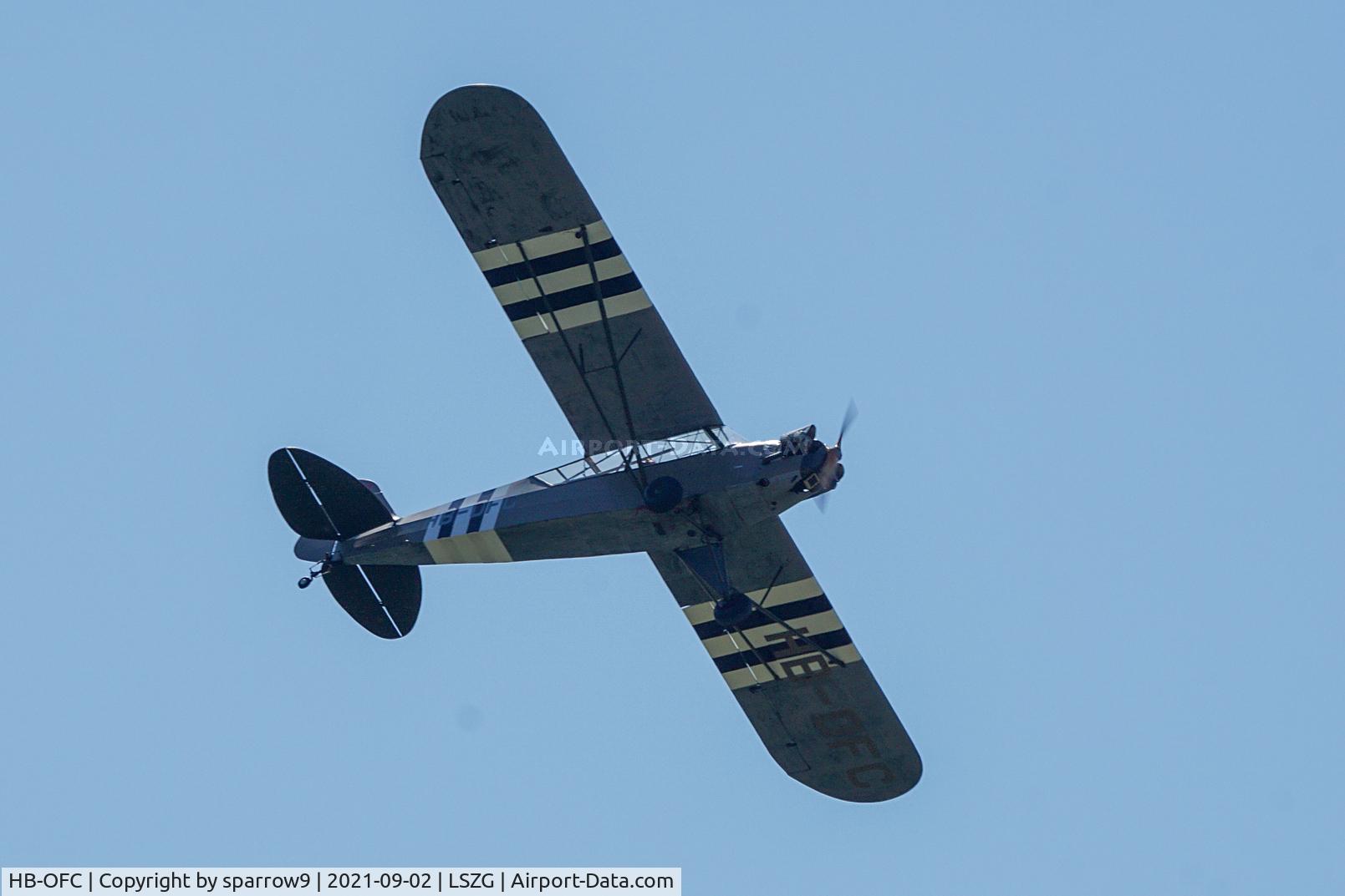 HB-OFC, 1943 Piper L-4H Grasshopper (J3C-65D) C/N 11114, Low circling overhead Grenchen