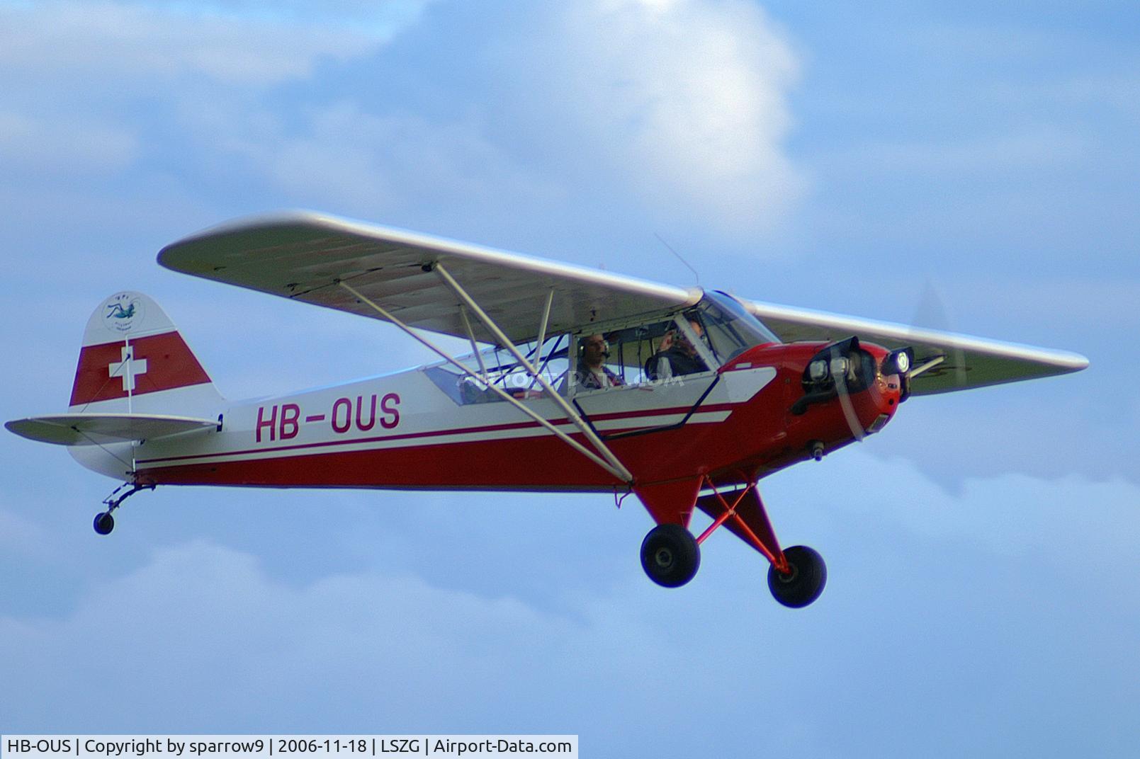 HB-OUS, 1943 Piper L-4H Grasshopper (J3C-65D) C/N 11502, Low flight. Based at Grenchen for more than 50 years. Re-engined with a Rolls-Royce O-200A