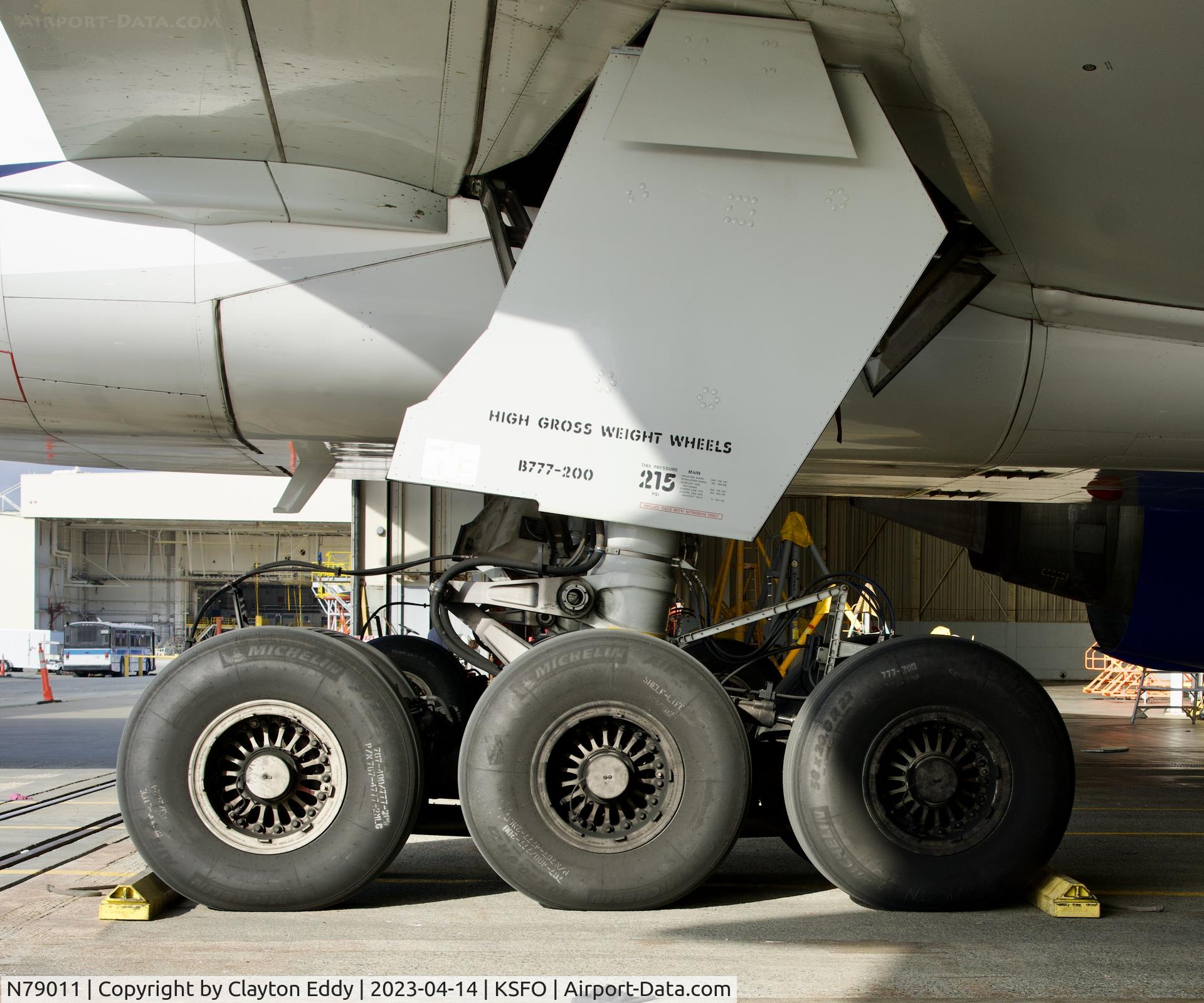 N79011, 1999 Boeing 777-224 C/N 29859, Right main gear. SFO 2023.