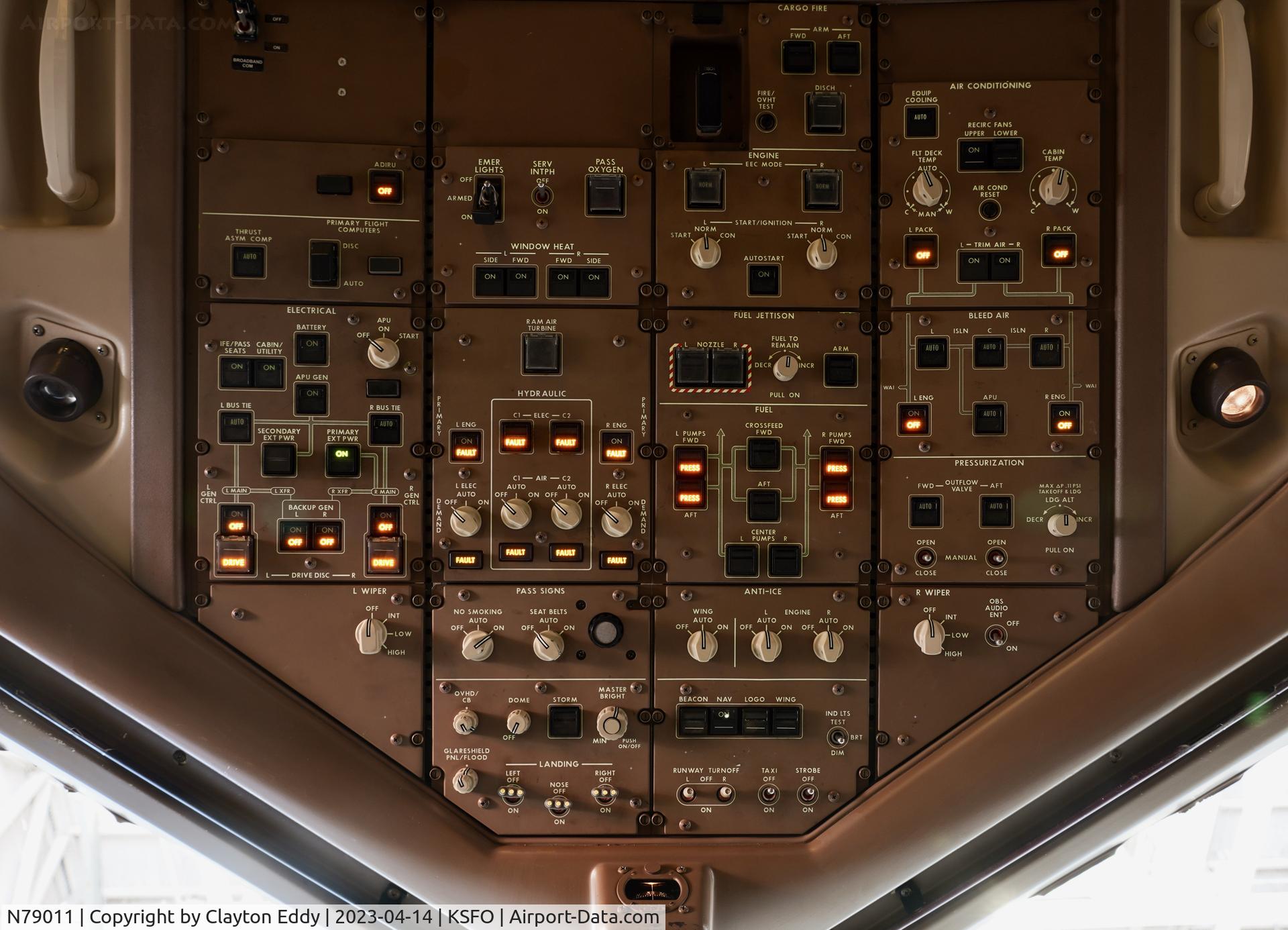 N79011, 1999 Boeing 777-224 C/N 29859, Flightdeck overhead panell SFO 2023.
